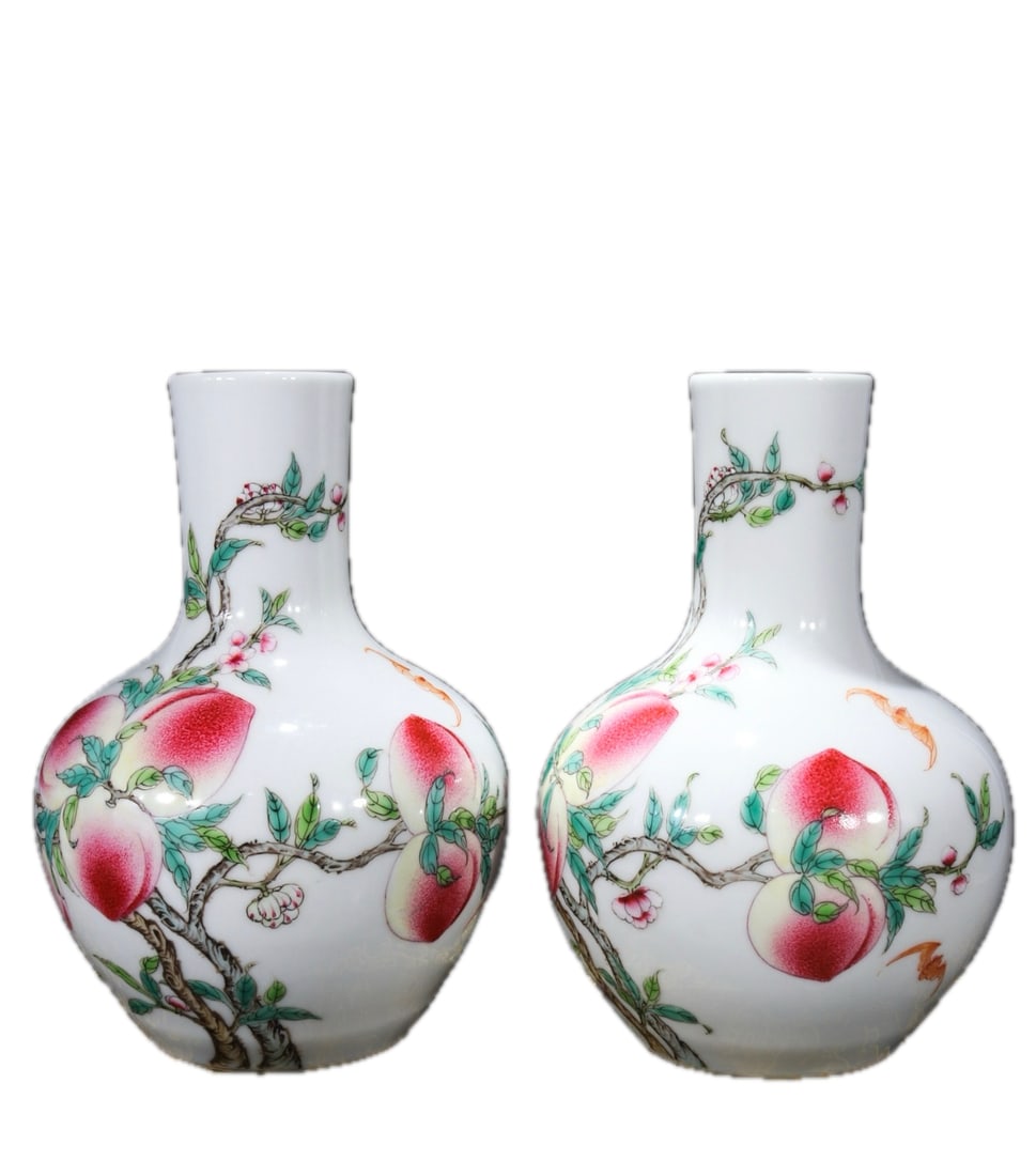 A pair of famille rose celestial globe vases with the mark "Made in the Qianlong Reign of the Great (1 of 9)
