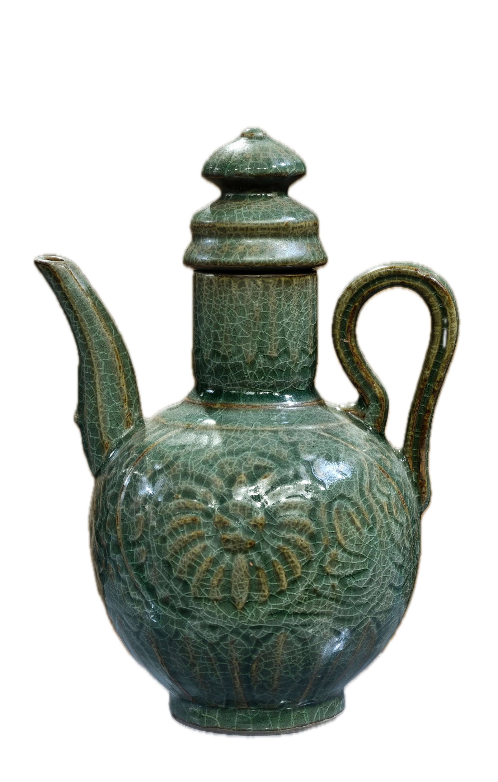 A peacock green ewer with small crackle decoration and an incised spout, formerly in the collection: A peacock green porcelain ewer with small crackle decoration and an incised spout, formerly in the collection and marked "Xiuneisi Kiln," 24 cm high and 17 cm wide. Provenance:Private collection from 