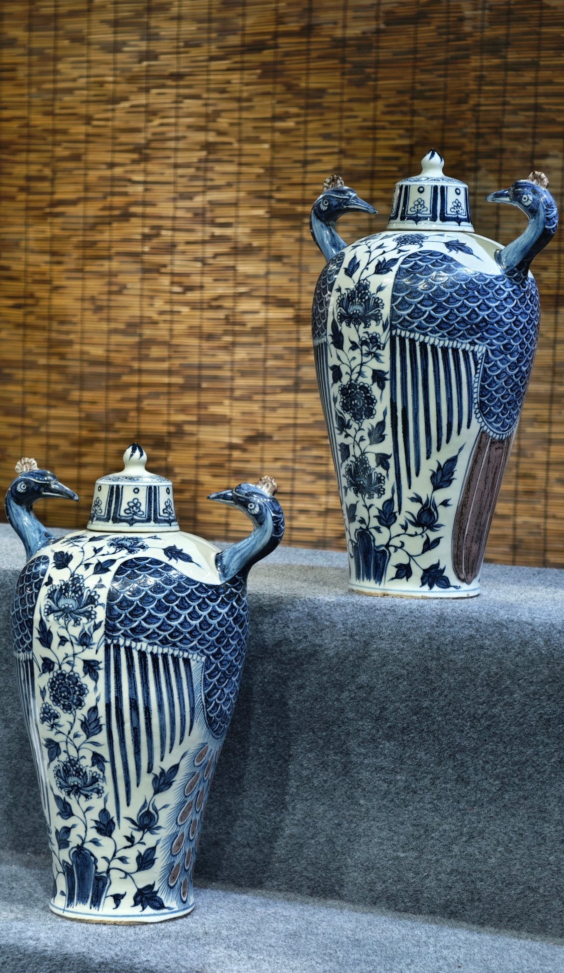A pair of Yuan Dynasty blue-and-white underglaze red sculpted peacock-shaped double-necked vases: A pair of Yuan dynasty blue-and-white underglaze red sculpted peacock-shaped double-necked vases with lids, 47 cm high and 30 cm wide. Provenance:From a noted private collection in Aix-en-Provence, Fr