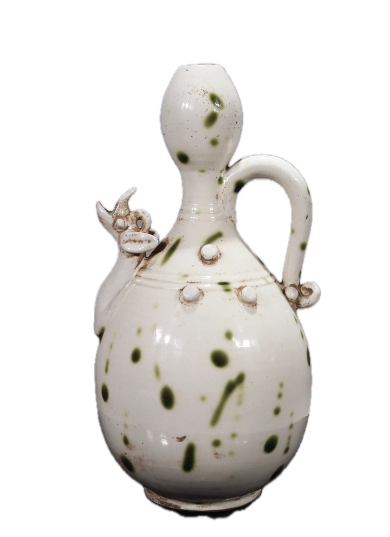 Formerly owned white-glazed Xing kiln oil-spot dragon-head ewer (1 of 9)