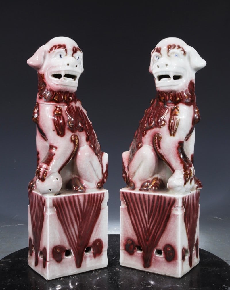 A pair of Ming Hongwu underglaze red table lions from the collection: A pair of Ming Hongwu underglaze red table lions, 32 cm high and 11 cm wide, formerly in the collection. Provenance:From a noted private collection in Aix-en-Provence, France. We warmly invite collect