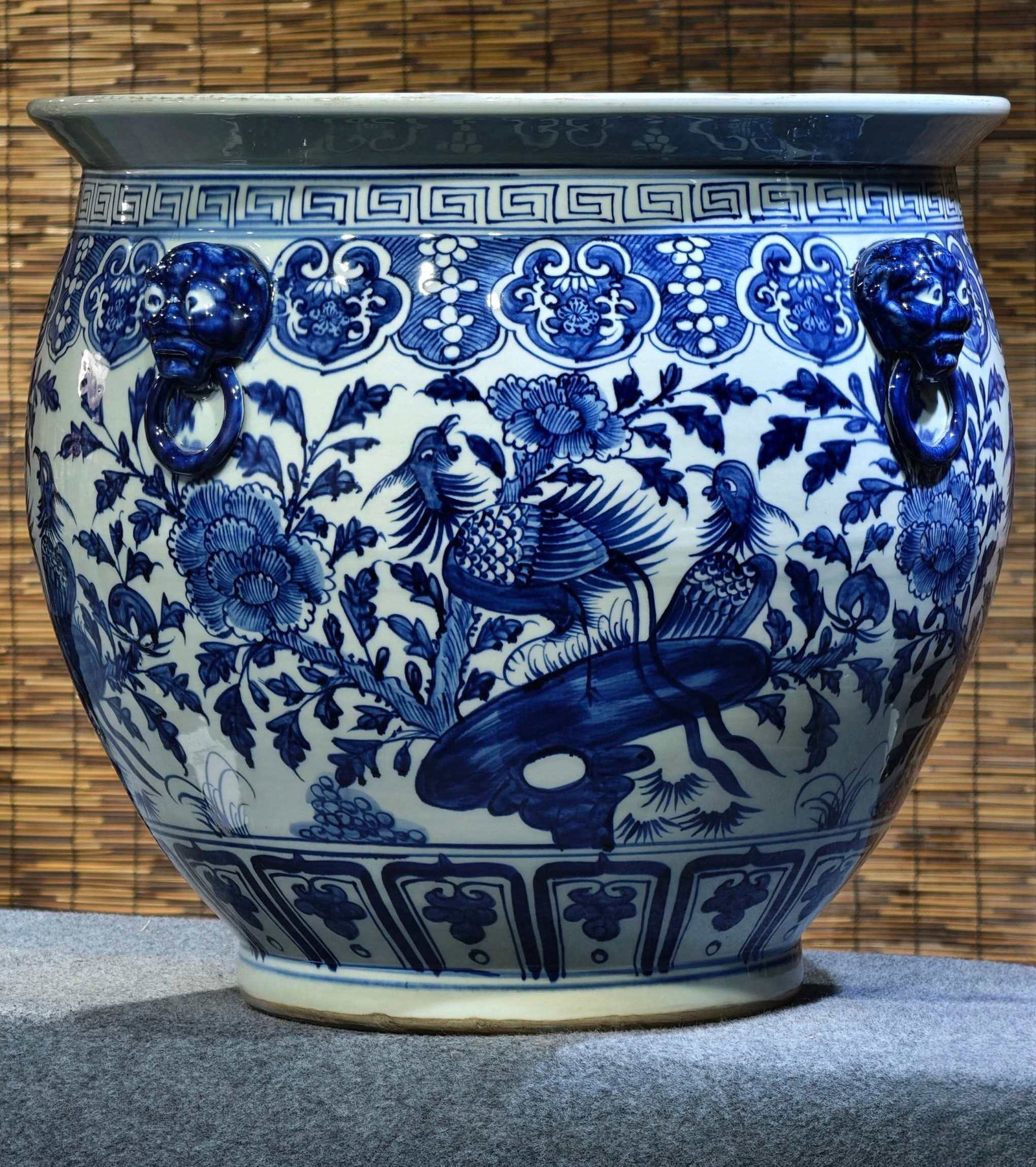 A large blue-and-white porcelain jar from the late Qing dynasty, with hand-painted animal heads and: Formerly in the collection, late Qing dynasty blue and white porcelain large jar with hand-painted animal head handles and four lugs, 52 cm high and 58 cm wide. Provenance:From a noted private collect