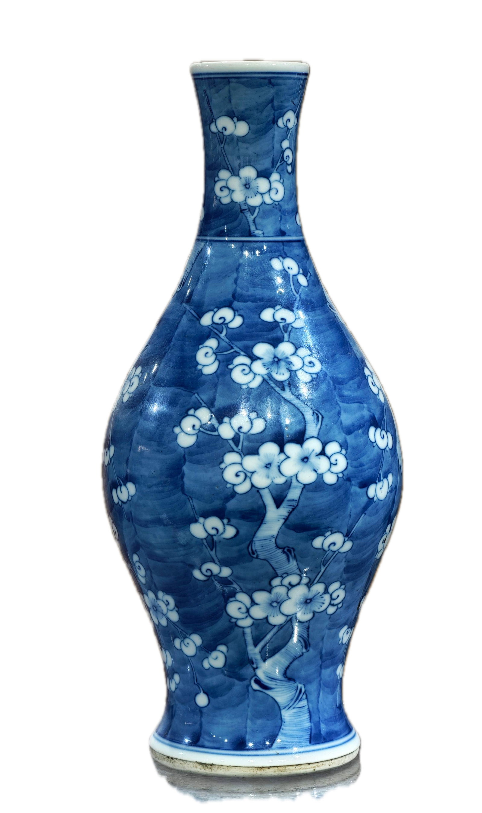 A mid-Qing dynasty hand-painted blue and white olive-shaped vase with plum blossom design, made of: A mid-Qing dynasty hand-painted underglaze blue olive-shaped vase with a rice-grain body and a design of plum blossoms in white space, formerly in the collection. Height: 27.5 cm, Width: 13 cm. Proven