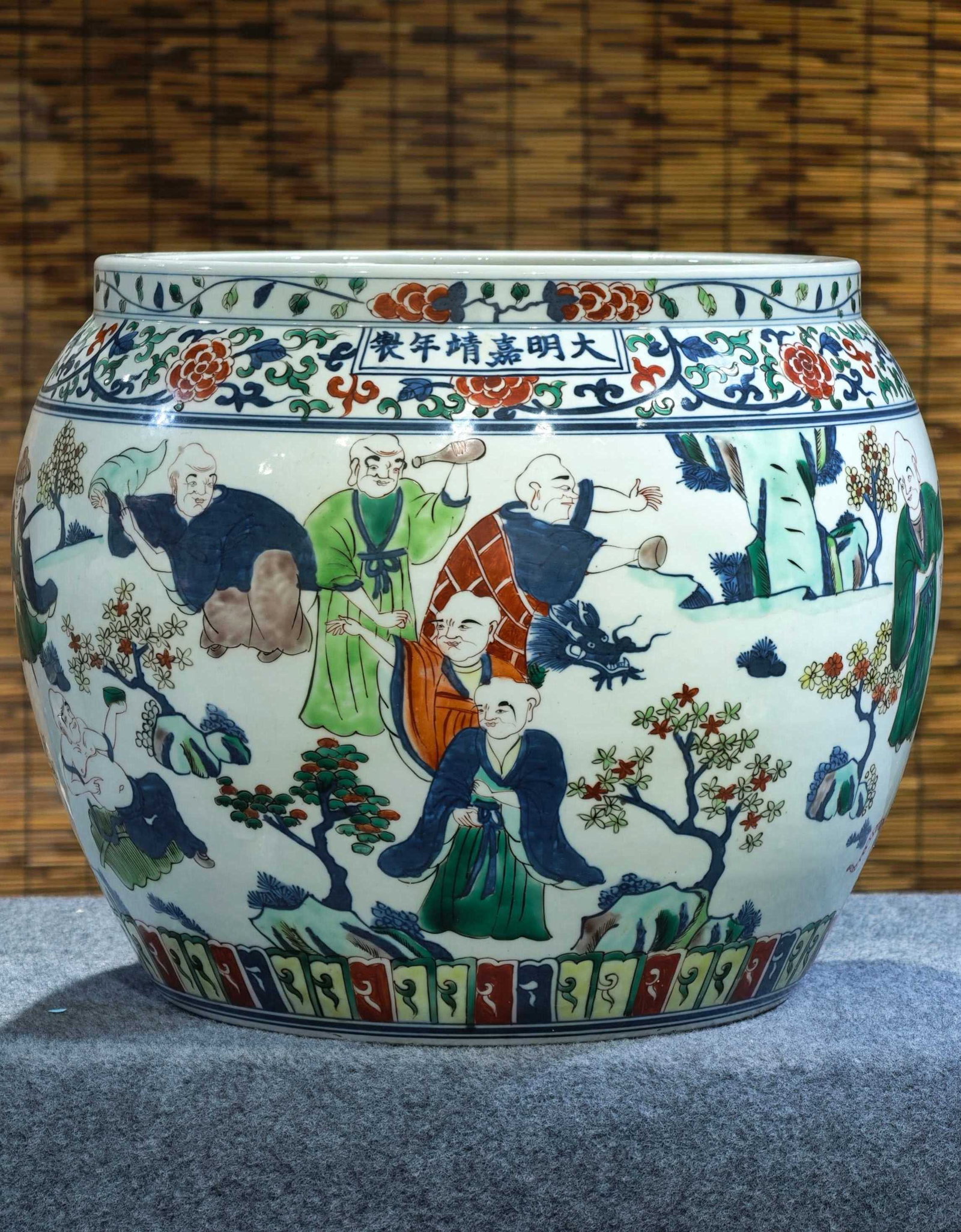 A blue and white porcelain jar with overglaze enamels depicting eighteen Arhats, formerly in the (1 of 11)