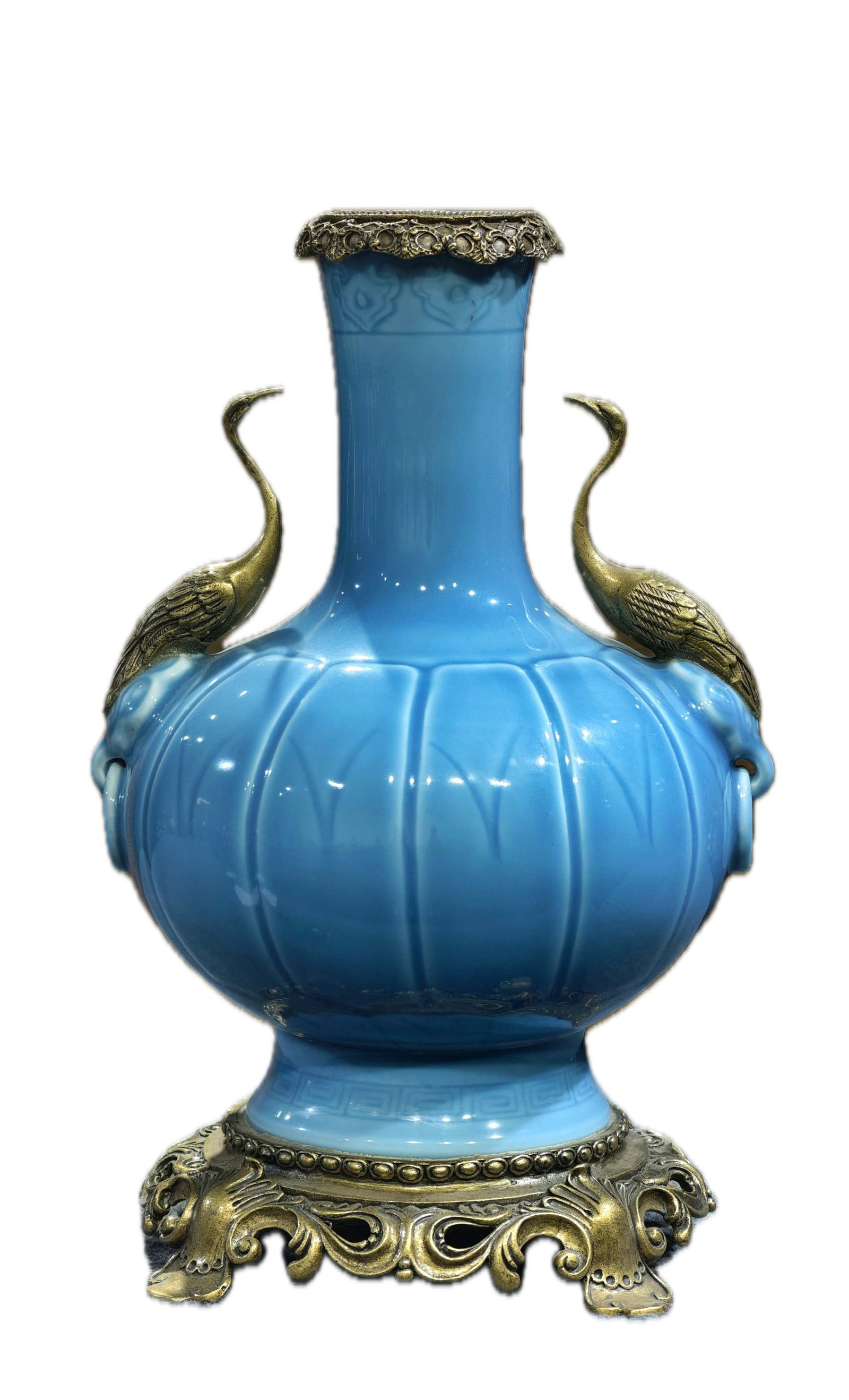 A fine monochrome porcelain vase with animal-head handles and double cranes, bearing the mark "Made: A fine monochrome porcelain vase with animal-head handles and double cranes, bearing the mark "Made in the Qianlong Reign of the Great Qing Dynasty," 36 cm high and 24 cm wide. Provenance:From a priva