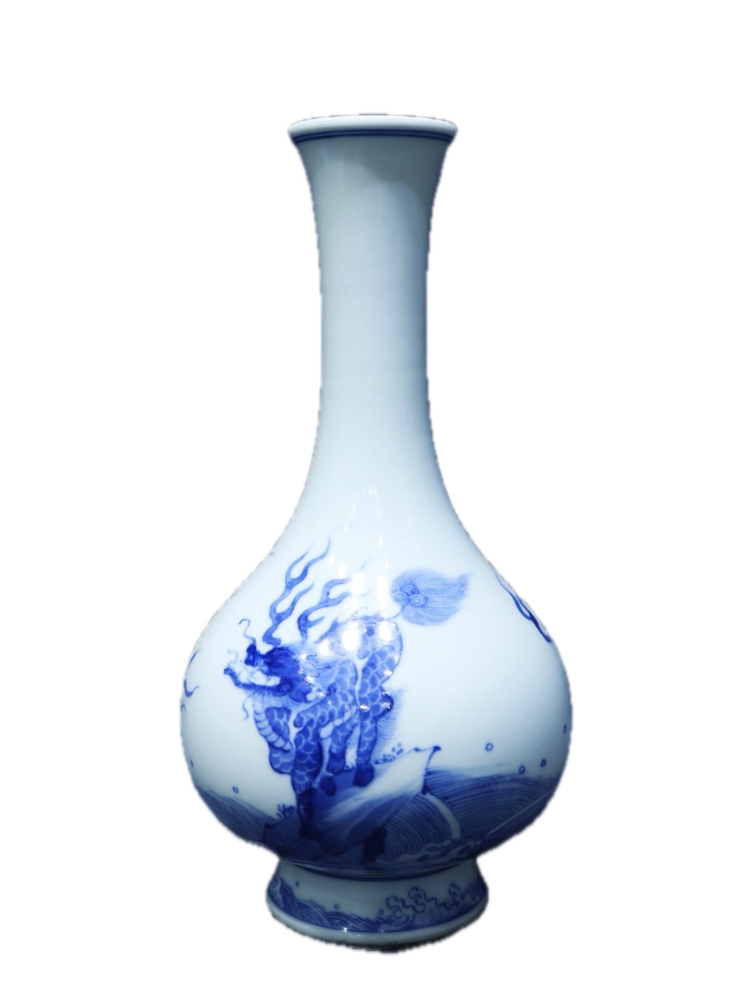 A blue and white porcelain duster with a Kangxi reign mark and wave and qilin design, formerly in: A blue and white porcelain duster with a Kangxi reign mark and a design of a sea wave and a qilin, 20 cm high and 10 cm wide. Provenance:Private collection, Hamburg, Germany. We warmly invite collecto