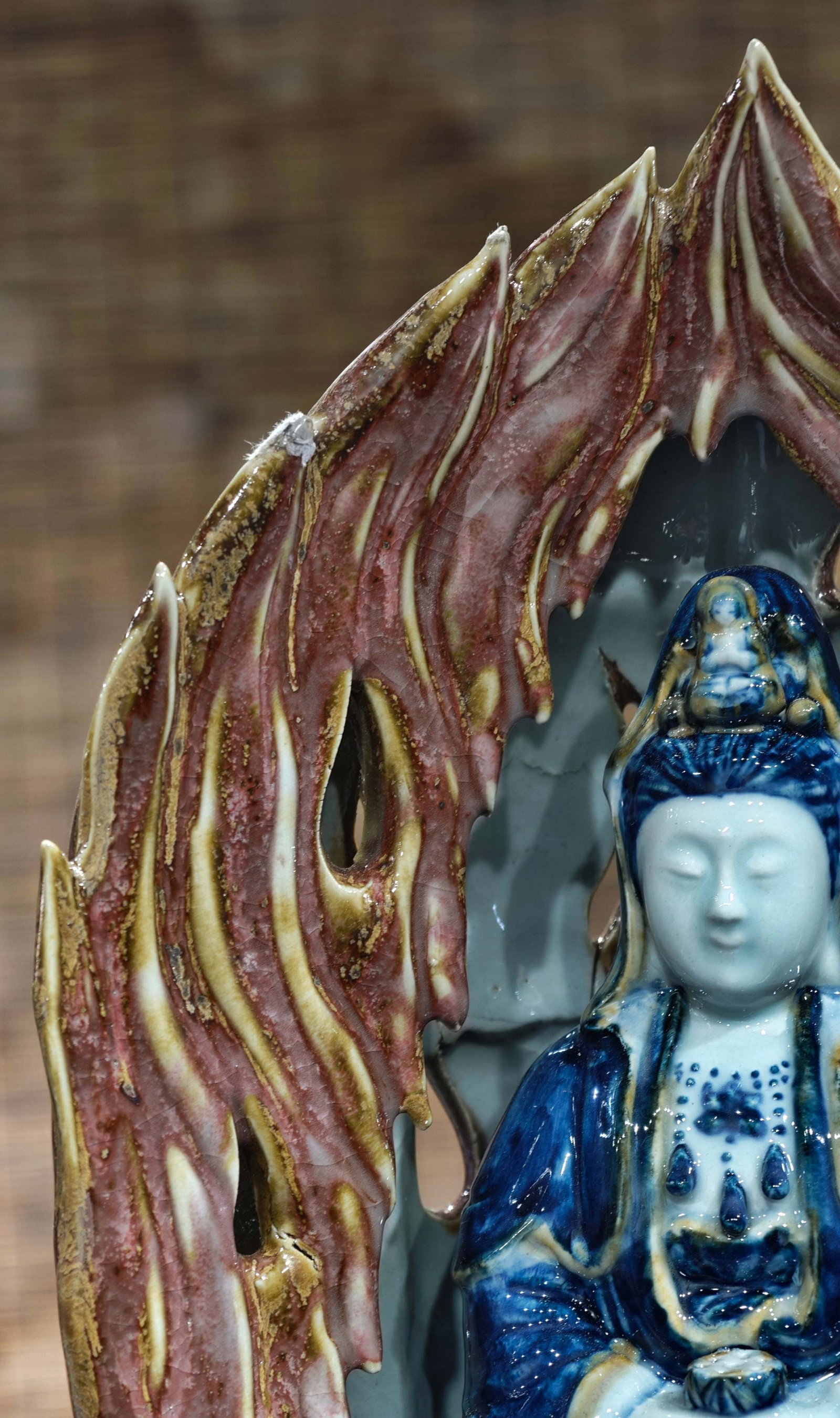 Formerly in the collection, marked "Made in the Qianlong Period" - a fully hand-painted underglaze: Formerly in the collection, marked "Made in the Qianlong Period," a fully hand-painted underglaze blue and overglaze sculpted Guanyin Bodhisattva statue, 31 cm high and 20 cm wide. Provenance:Private 