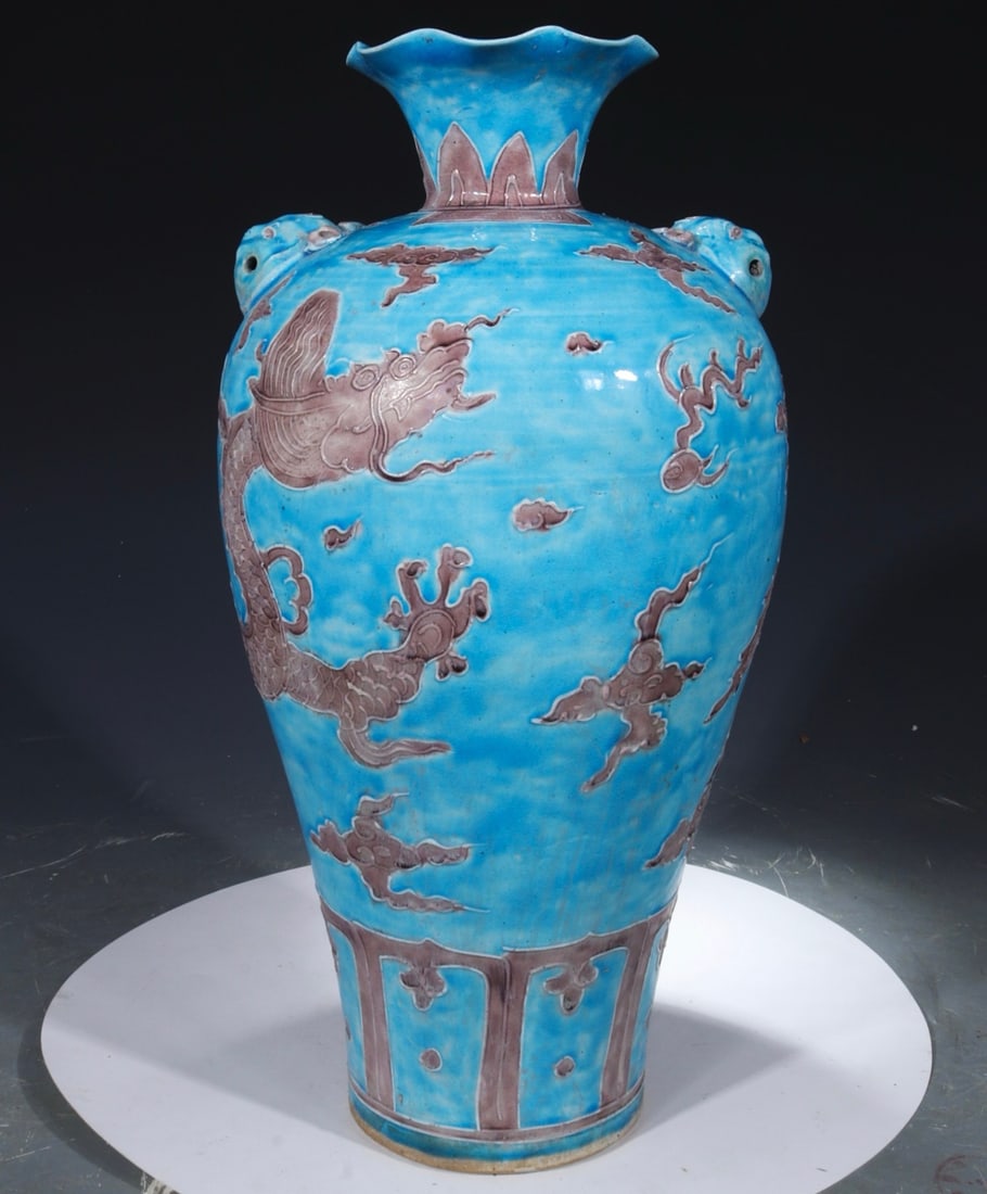 A formerly owned, eggplant-purple glazed plum vase with dragon design, bearing the mark "Made in the (1 of 9)