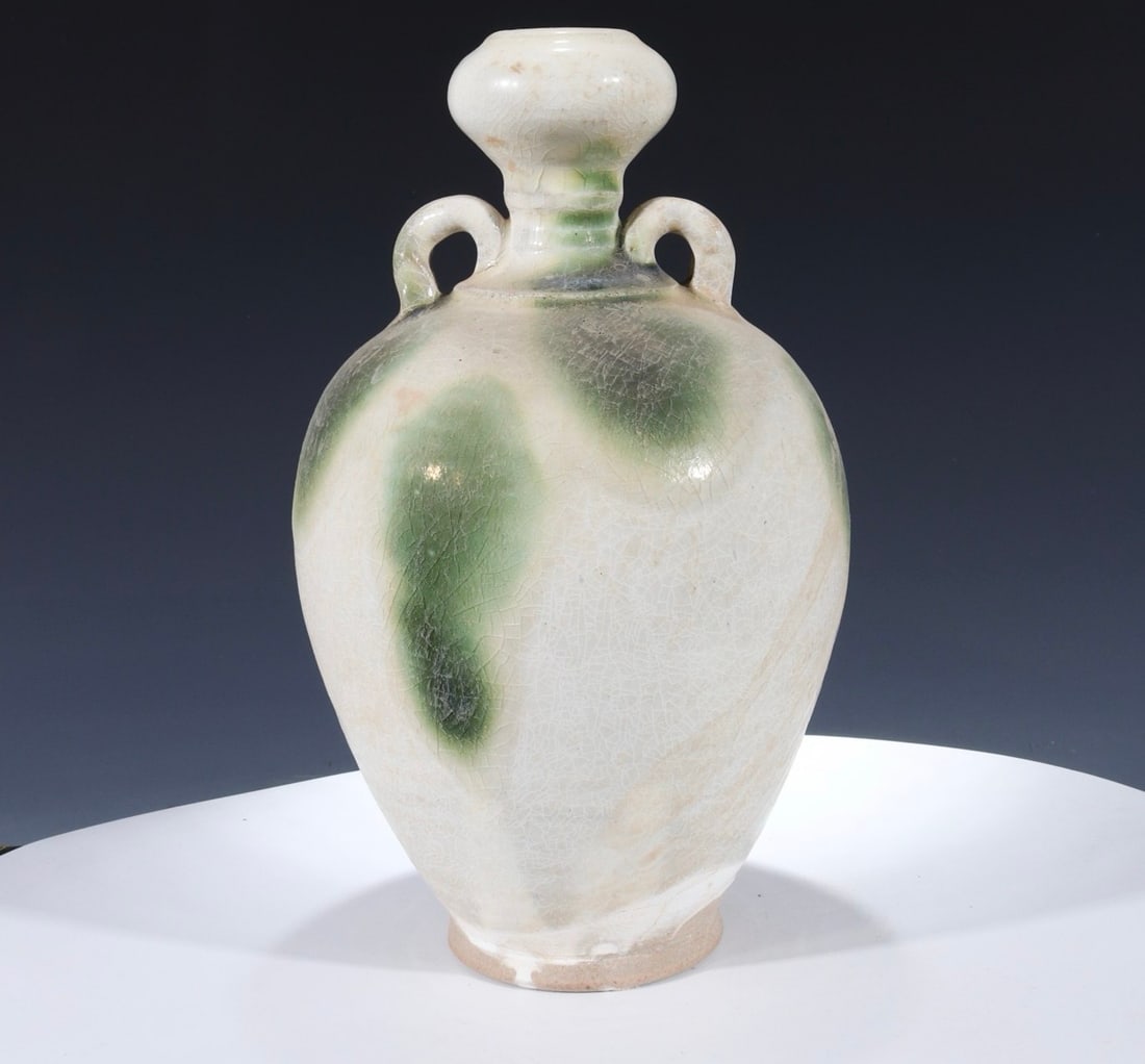 Formerly owned Song Dynasty kiln vases with tubular handles: An old Song Dynasty kiln vase with tubular handles, 19 cm high and 13 cm wide. Provenance:Private collection, Hamburg, Germany. We warmly invite collectors, colleagues, and friends to join us for our 