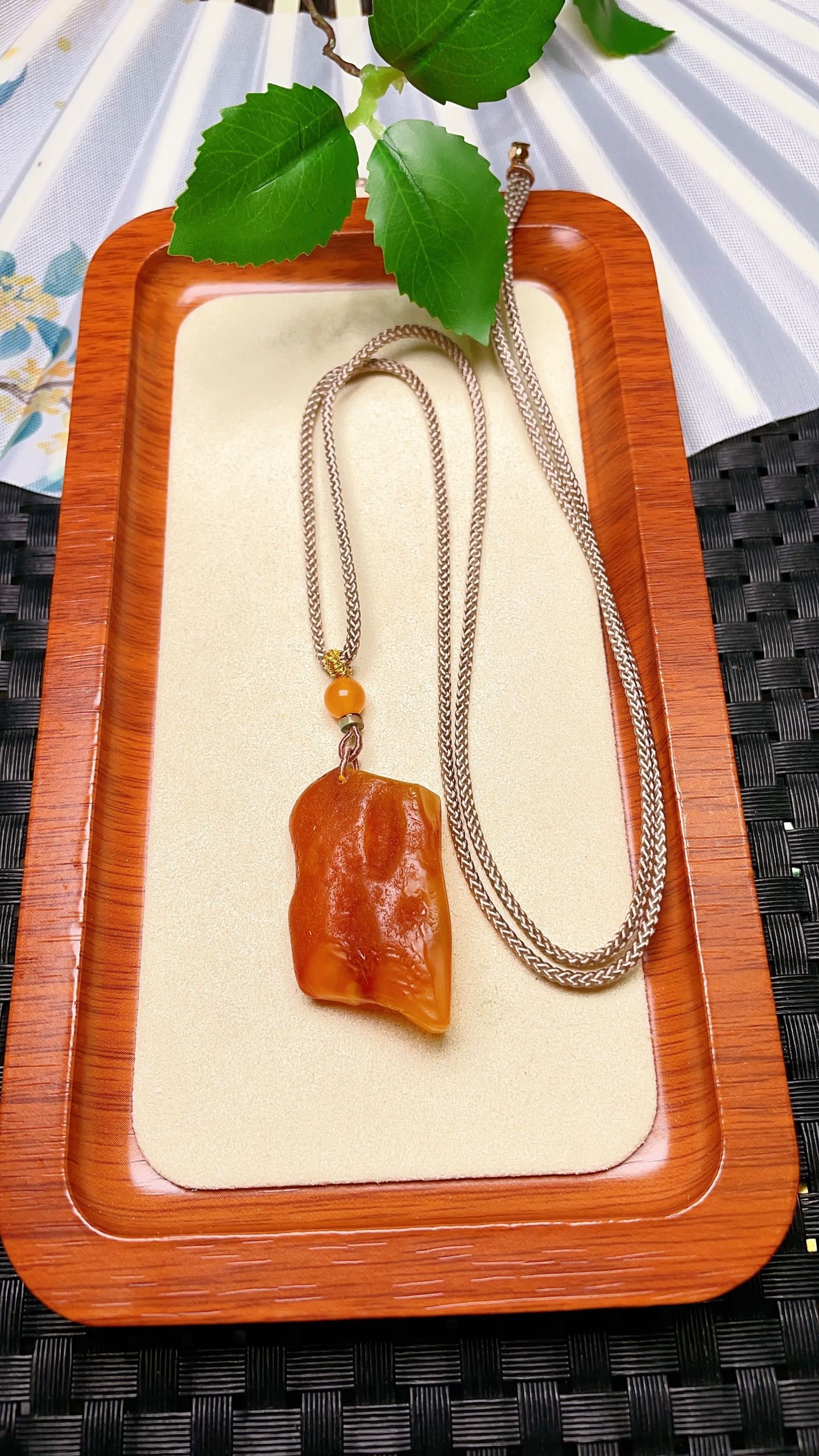 Original handmade custom natural amber pendant: Original handmade custom-made natural amber pendant with a lustrous, oily sheen. Dimensions: 39.2 x 22.1 x 12 mm. Comes with a fine cord. Total weight: 8.9g. Simple, elegant, and versatile. Provenance
