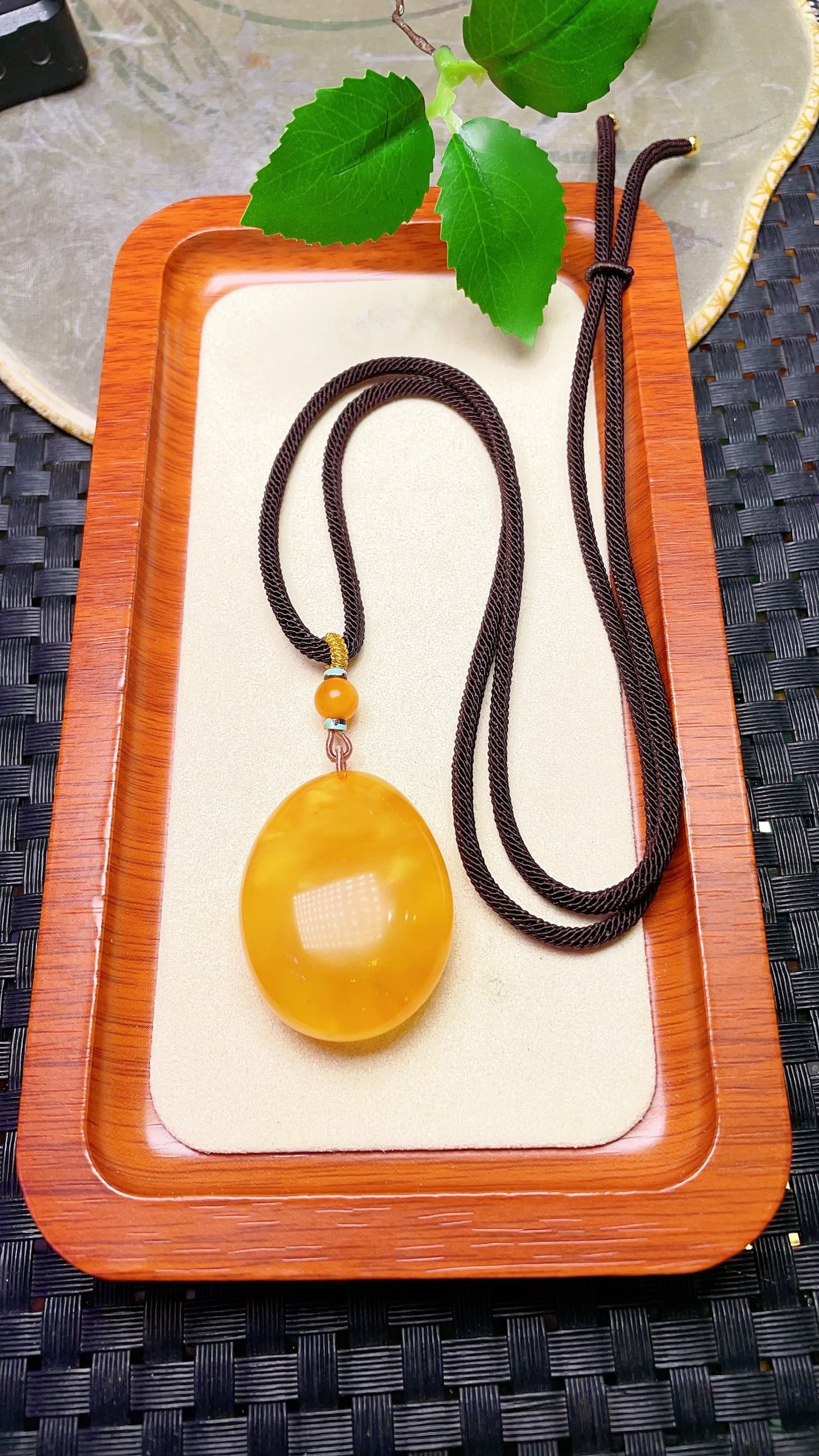 Original handmade custom natural amber teardrop pendant: Original handmade natural amber teardrop pendant with a lustrous, oily sheen. Dimensions: 38.8 x 30.4 x 15.8 mm. Comes with a fine cord. Pendant weight: 11.4g, total weight: 14.8g. Simple, elegant, an