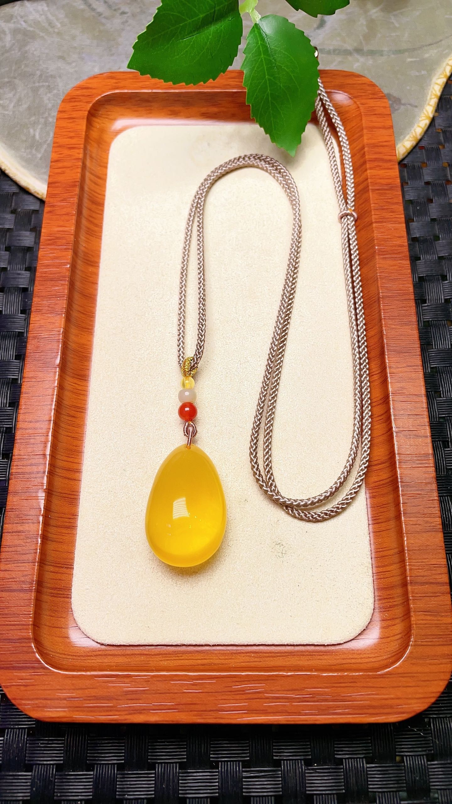 Original handmade custom natural amber teardrop pendant: Original handmade natural amber teardrop pendant with a lustrous, oily sheen. Dimensions: 29.3 x 19 x 13.3 mm. Comes with a fine cord. Total weight: 6.1g. Simple, elegant, and versatile. Provenance:An