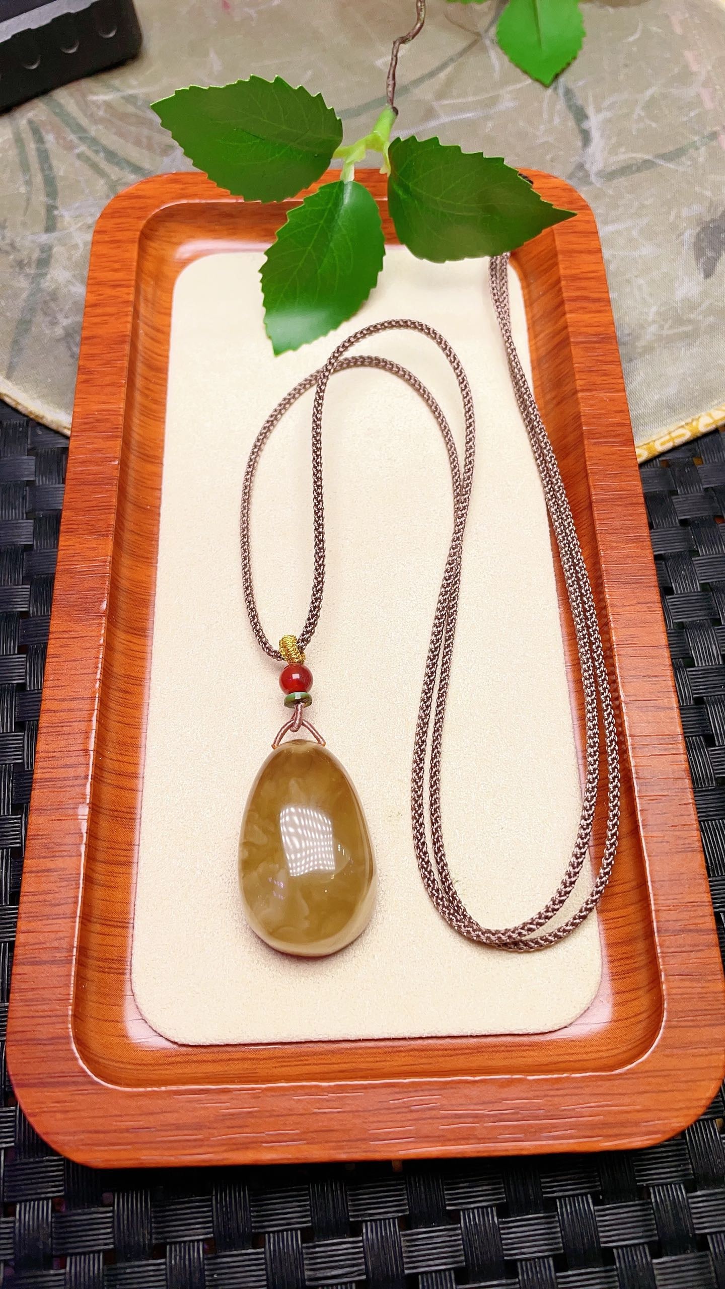 Original handmade custom natural amber teardrop pendant: Original handmade natural amber teardrop pendant with a lustrous, oily sheen. Dimensions: 32.1 x 20.5 x 14.2 mm. Comes with a fine cord. Total weight: 7.9g. Simple, elegant, and versatile. Provenance: