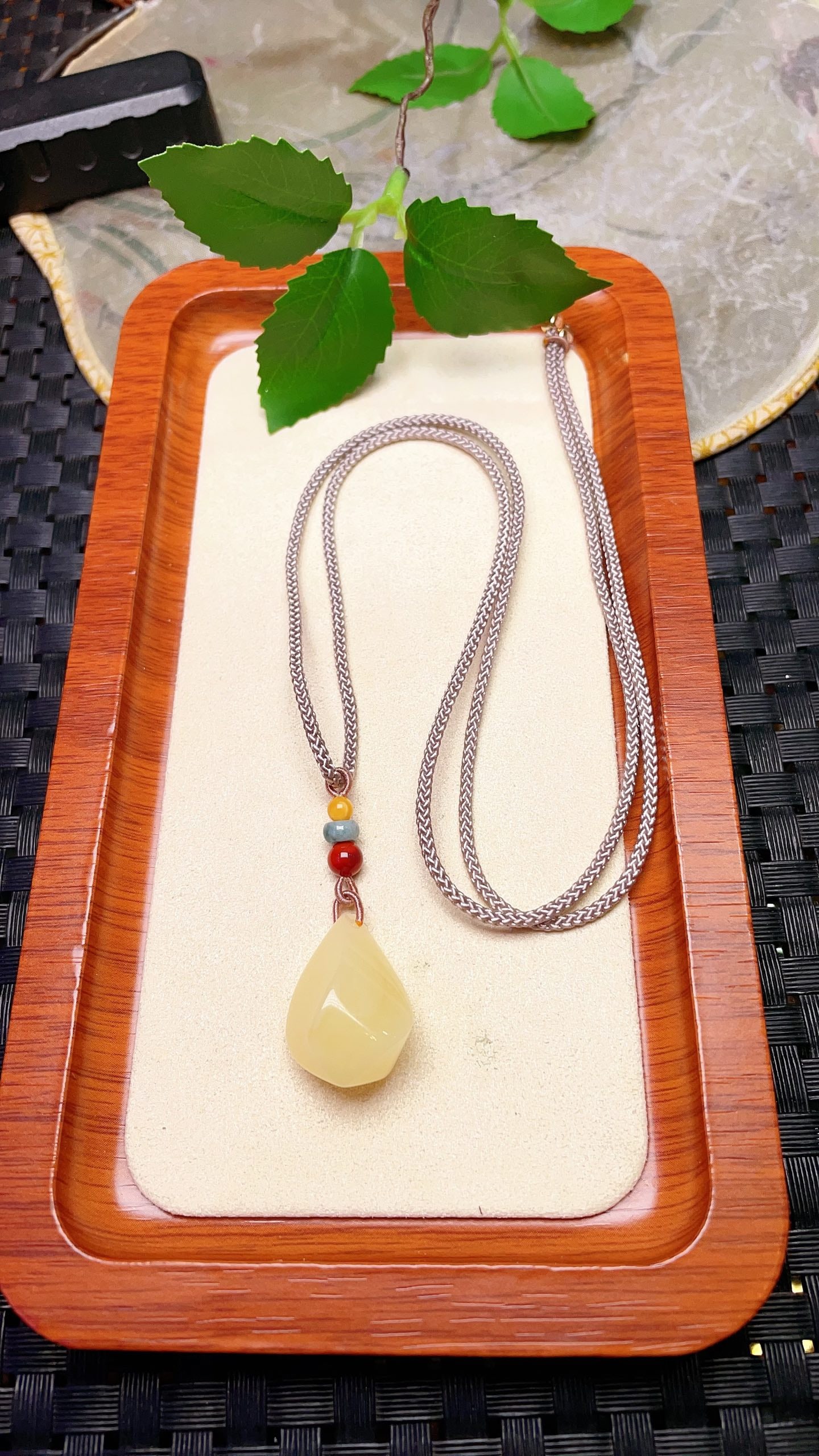 Original handmade custom natural amber teardrop pendant: Original handmade natural amber teardrop pendant with a lustrous, oily sheen. Dimensions: 25 x 14.5 mm. Comes with a fine cord. Total weight: 4.7g. Simple, elegant, and versatile. Provenance:From a pr