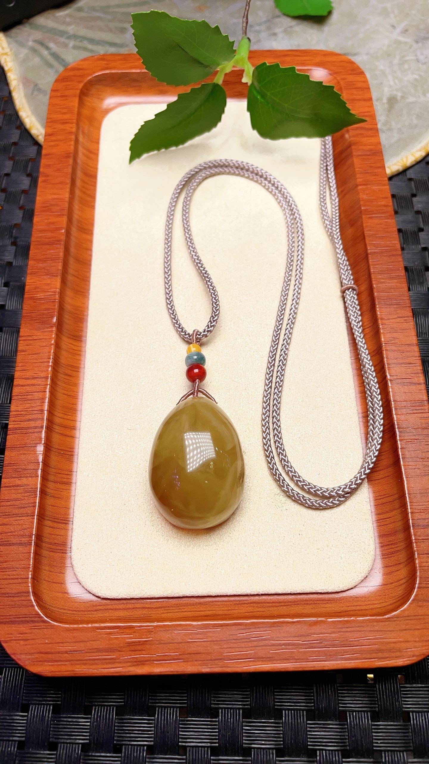Original handmade custom natural amber teardrop pendant: Original handmade natural amber teardrop pendant with a lustrous, oily sheen. Dimensions: 30.4 x 22.7 x 16.8 mm. Comes with a fine cord. Total weight: 10g. Simple, elegant, and versatile. Provenance:F