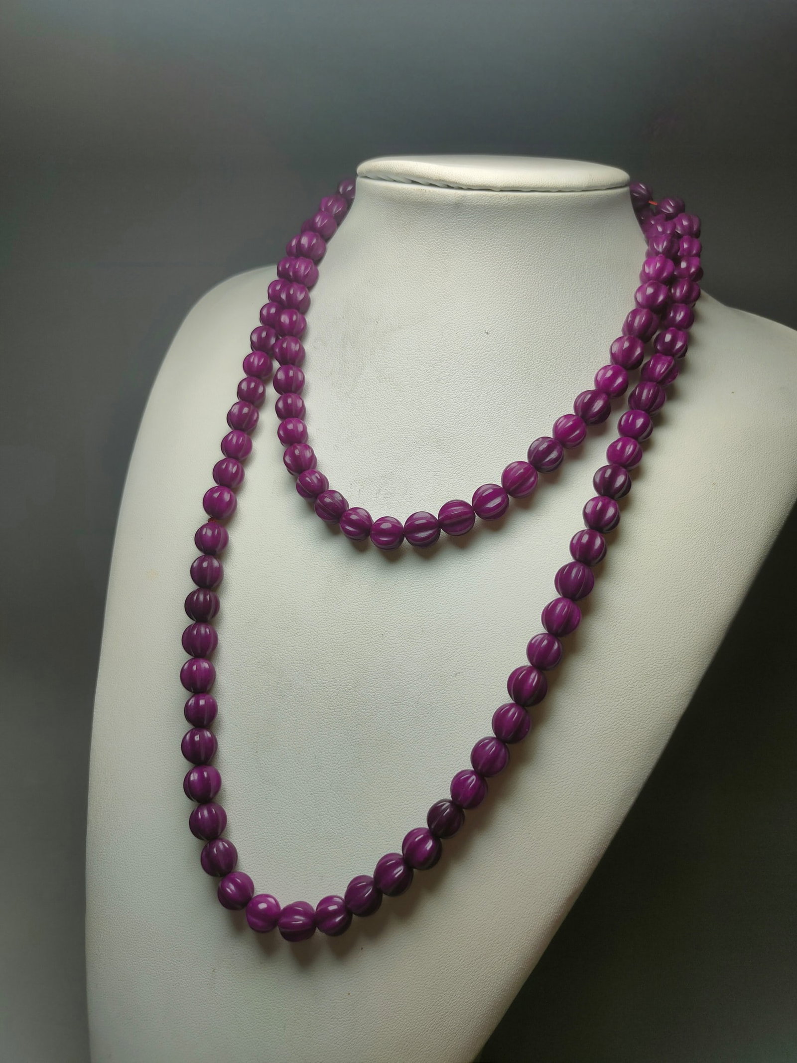 108 Violet Gemstone Necklace: A necklace with 108 violet gemstones. Each bead is 1cm in diameter and weighs 131g. Provenance:from the collection of George Stopher, Kent, purchased from P&M Waldo Antiques, London. We warmly invite 