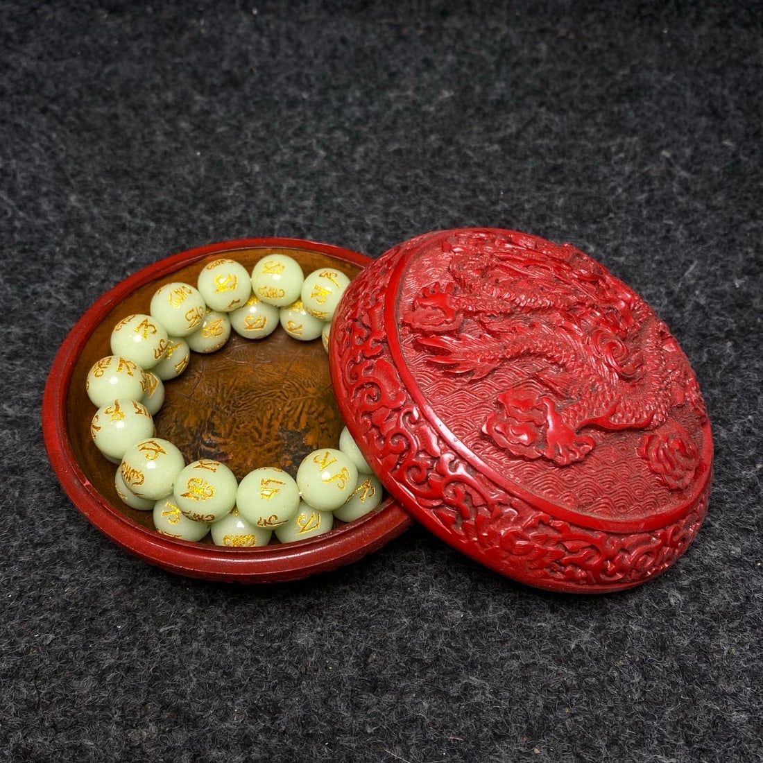 Carved red lacquerware with dragon pattern, luminescent six-character mantra bracelet inside the (1 of 9)