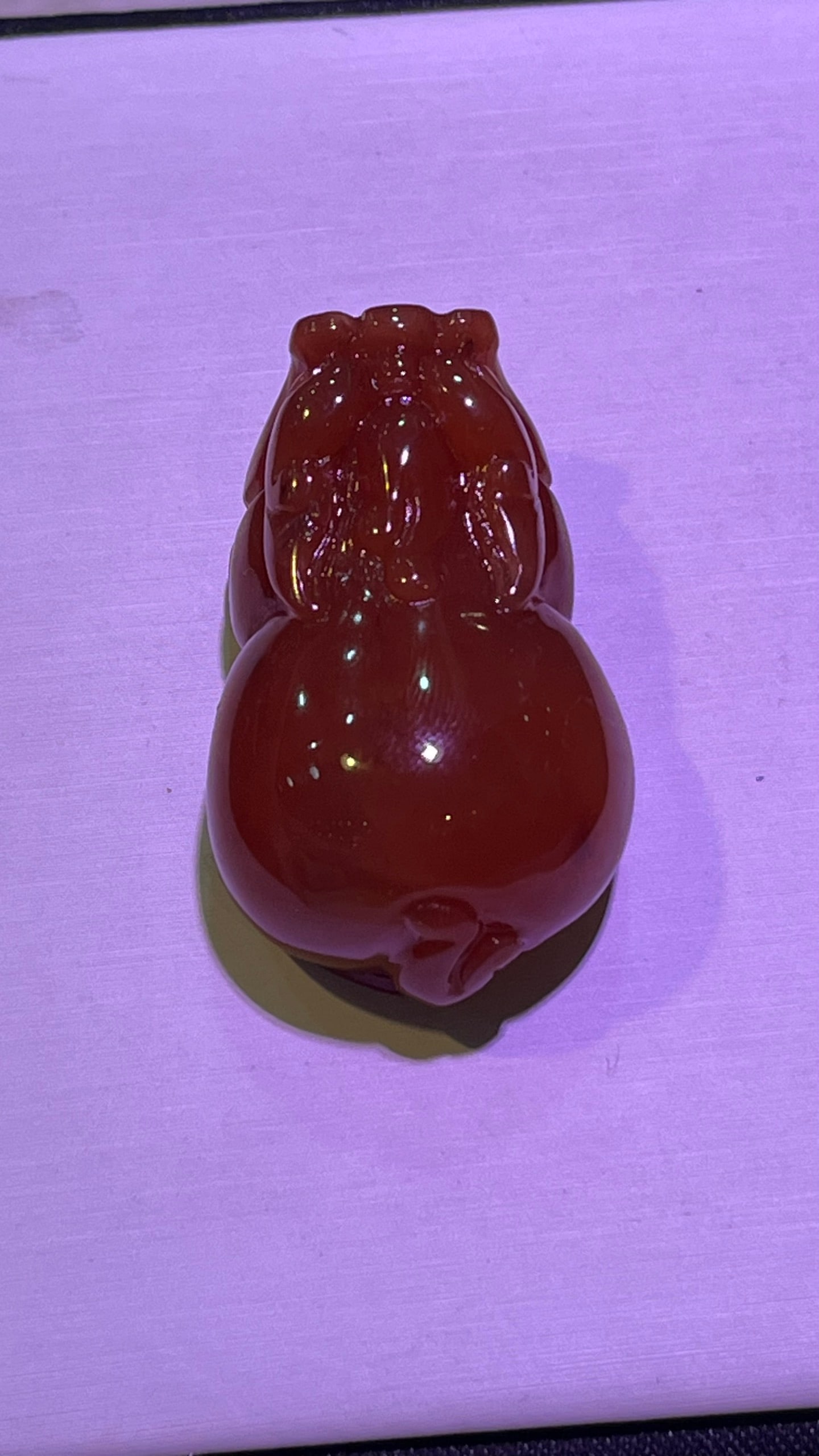 Pure natural red crystal and red rabbit hair Pixiu pendant: This is a pure natural red crystal pendant featuring a red rabbit hair Pixiu (a mythical creature believed to bring wealth and prosperity). The crystal is clear and has a rich red color. The carving i