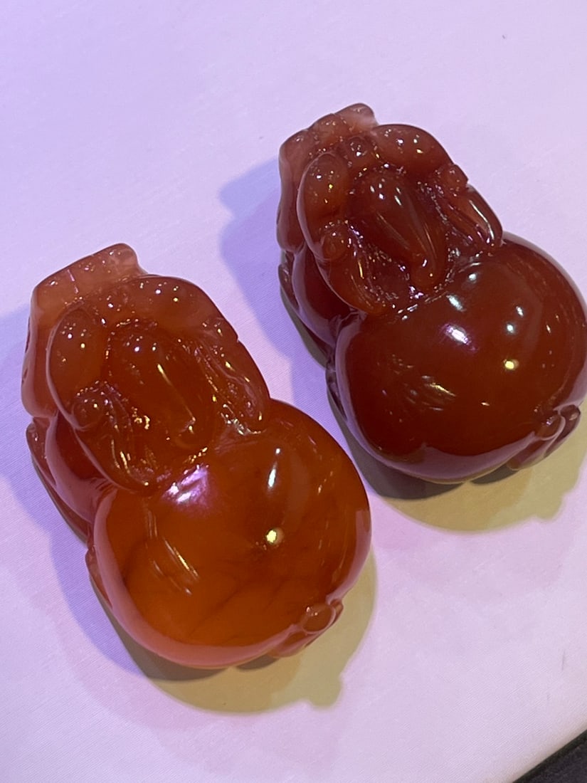 Pure natural red crystal and red rabbit hair Pixiu pendant: This is a pure natural red crystal with rabbit hair, featuring a Pixiu pendant. The crystal is clear and has a rich red color. The carving is exquisite, done by a master craftsman. The Pixiu symbolize