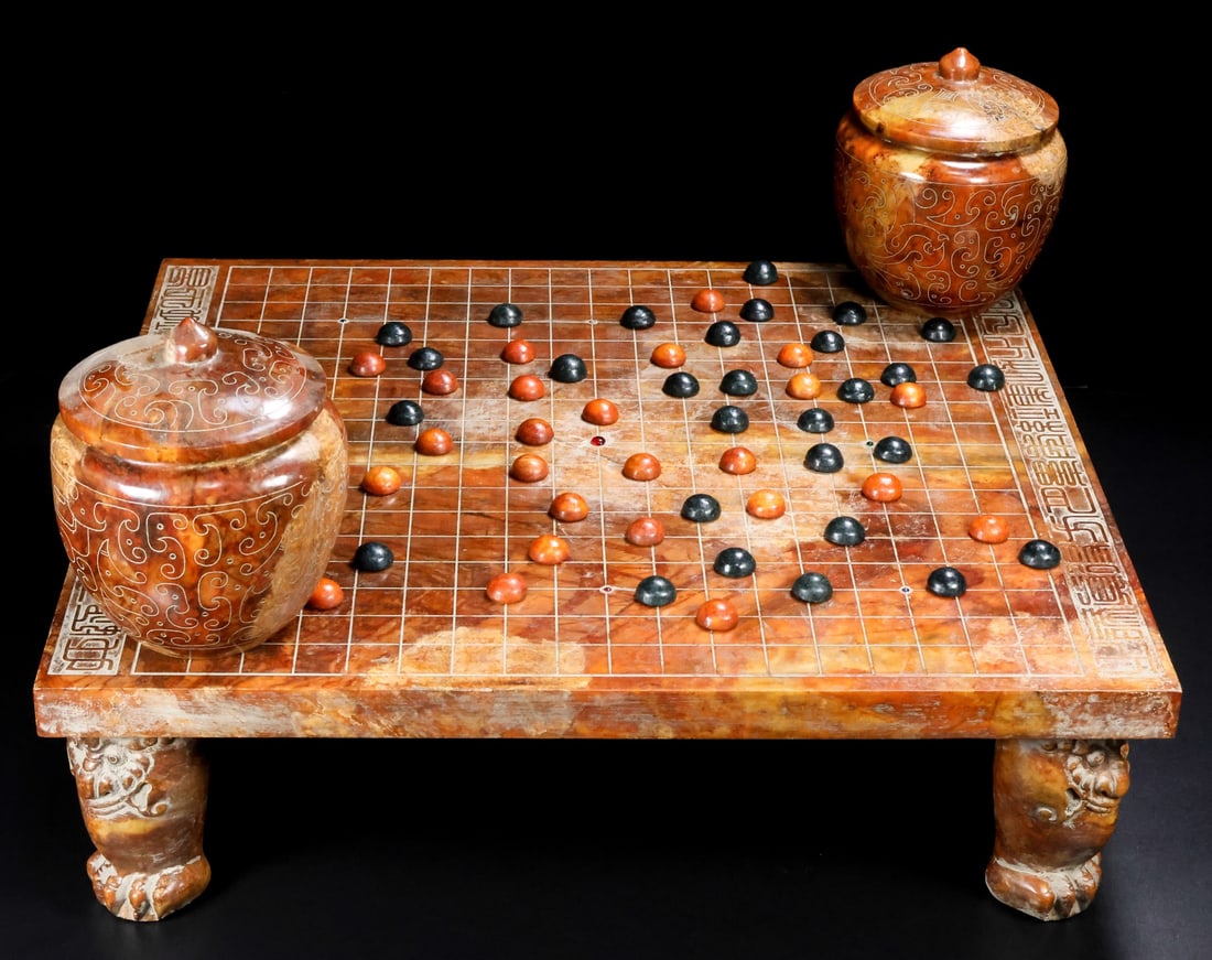 A set of Hetian jade Go stones: This set of Hetian jade Go stones features fine jade, exquisite carving, smooth lines, and perfect condition. Details are shown in the picture. It measures 50cm in length, 44cm in width, and 15cm in h