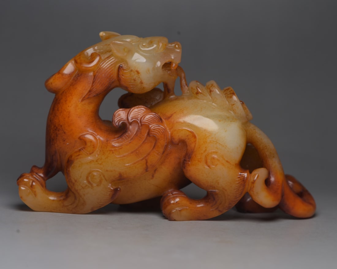 Hotan Jade Beast: Jade beast from Hetian: 13 x 7.8 x 3.9 cm, weighing 382 g. Provenance:Private collection, Liverpool, The United Kingdom. We warmly invite collectors, colleagues, and friends to join us for our auction