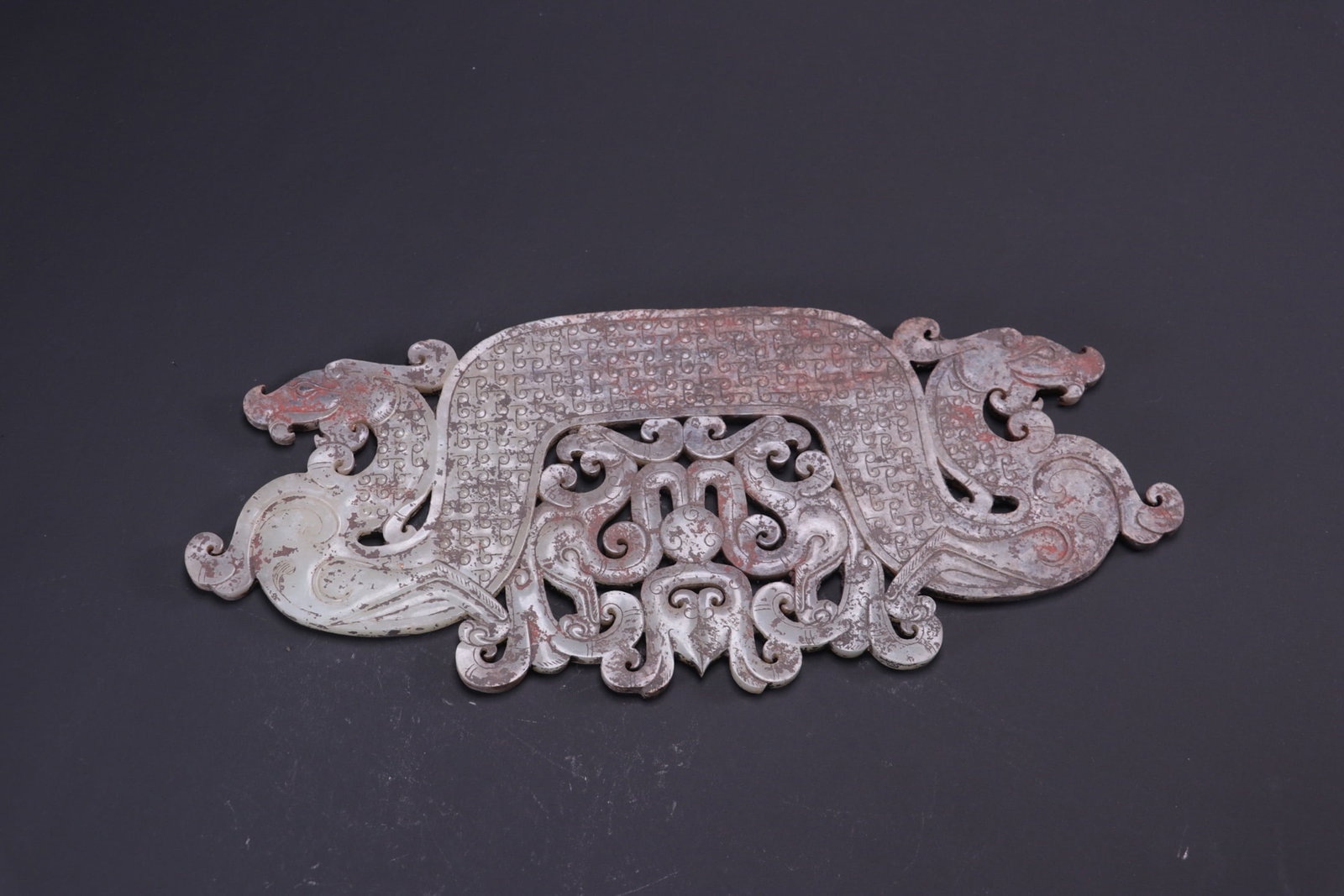 Formerly in the collection, ancient jade pendant with dragon design: Formerly in the collection, this ancient jade pendant with dragon design measures 28.2cm in length, 12cm in width, and 0.6cm in thickness, weighing 382g. Provenance:Private collection, Liverpool, The 