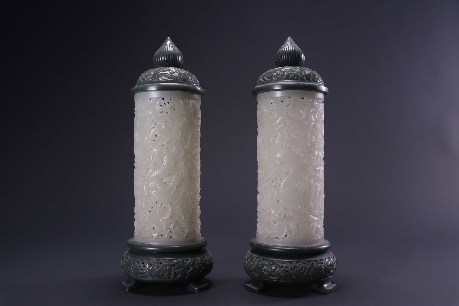 A pair of Hetian jade incense holders with openwork dragon and phoenix patterns, formerly in my: A pair of Hetian jade incense holders with openwork dragon and phoenix designs, formerly in the collection. Dimensions: Diameter 5.5cm, base diameter 7.5cm, height 20.5cm, total weight 658g. Provenanc