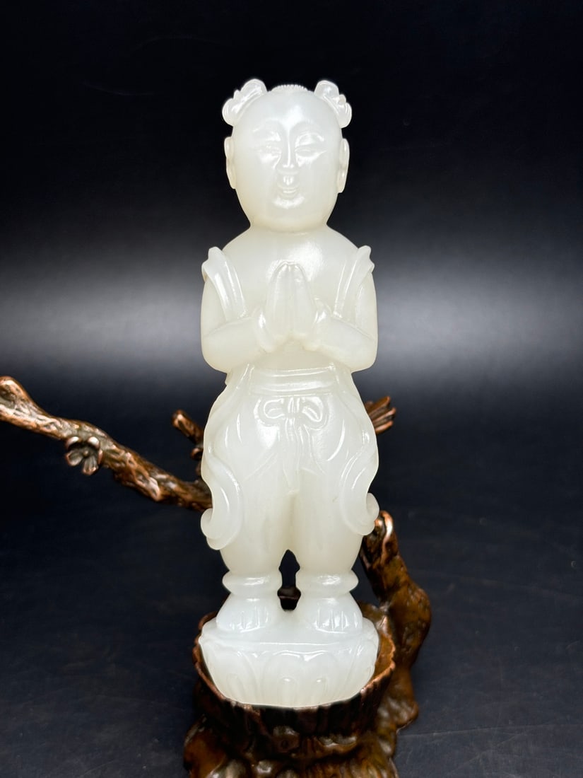 Exquisite Hetian Jade Sudhana: Exquisite Hetian jade carving of the Sudhana (Buddha's Child) with hands clasped in prayer, embodying a heart devoted to good deeds. The carving is exquisite, the jade is warm and lustrous, and has a 