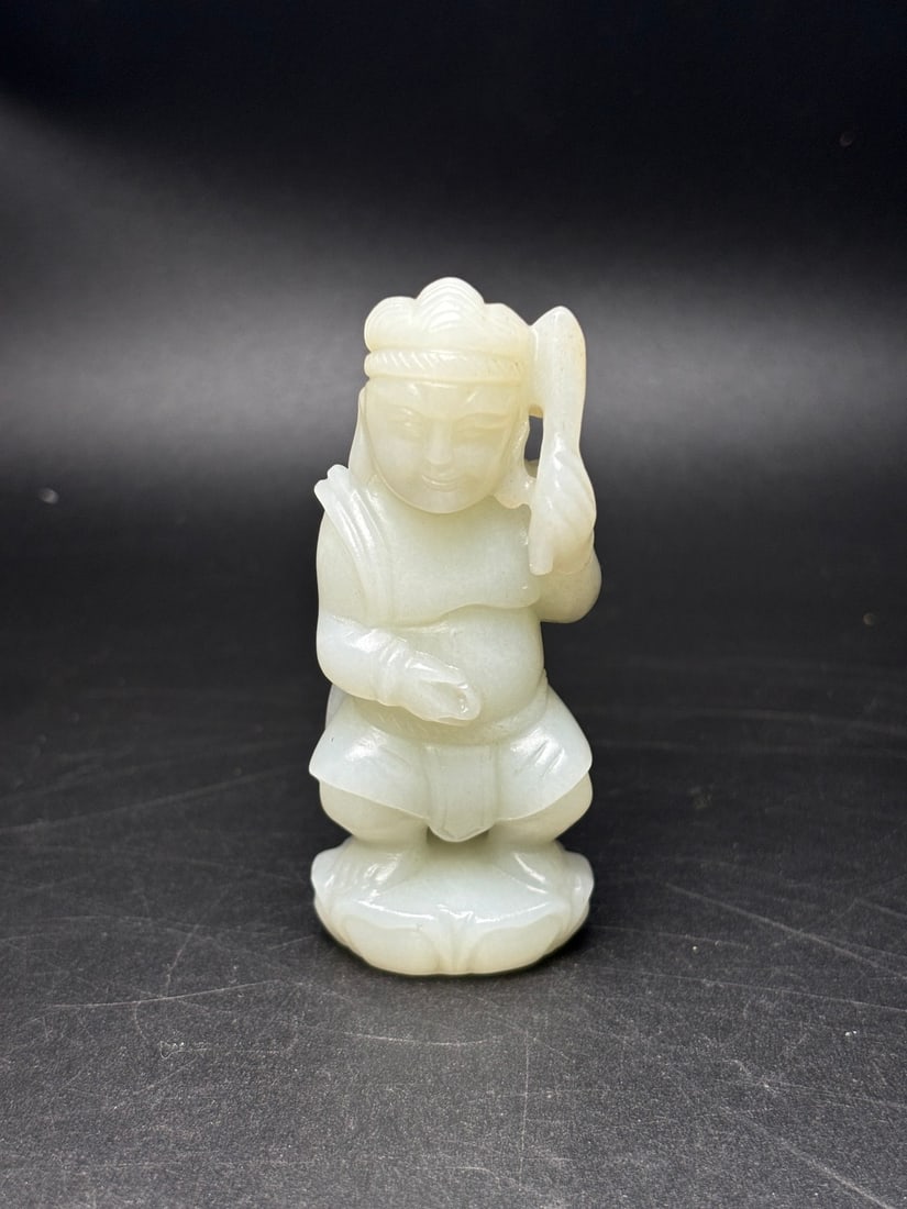 Exquisite Hetian jade Hu-style hand-held piece: Exquisite Hetian jade carving of a Central Asian figure, lifelike and exquisitely carved. The jade is warm and lustrous with a rich patina. Dimensions: 76 x 30 x 22 mm. Weight: 74g. Provenance:Private