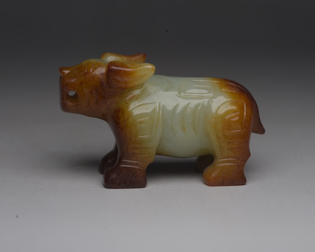 Hotan Jade Beast: Jade beast from Hetian: 5.6 x 3.3 x 2.3 cm, weighing 60 g. Provenance:Private collection from a professor in The University of Edinburgh. We warmly invite collectors, colleagues, and friends to join u