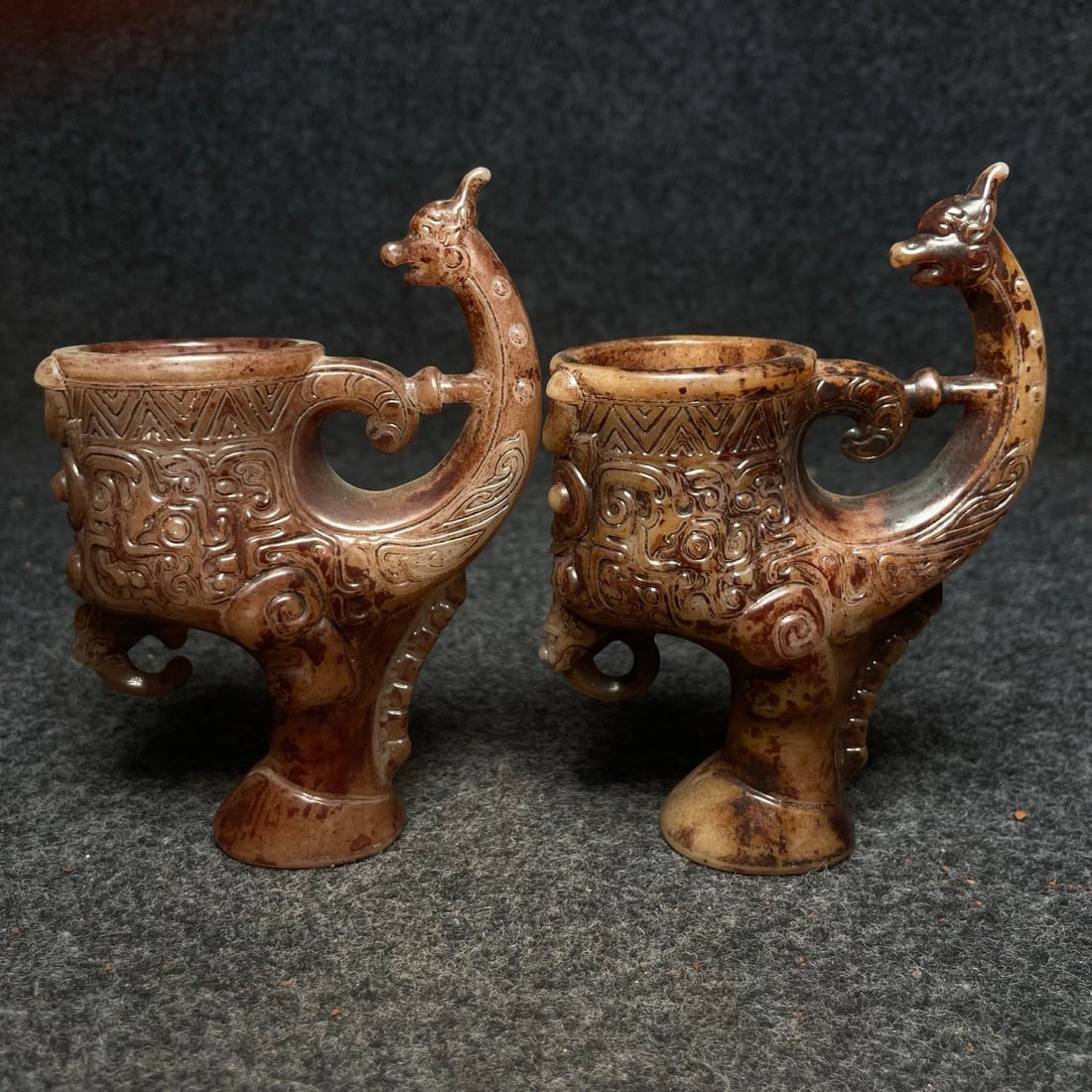 A pair of ancient jade ornaments: A pair of ancient jade ornaments, single size: 9 x 5 x 13 cm (length x width x height). Provenance:Private collection from a professor in University of Glasgow. We warmly invite collectors, colleagues