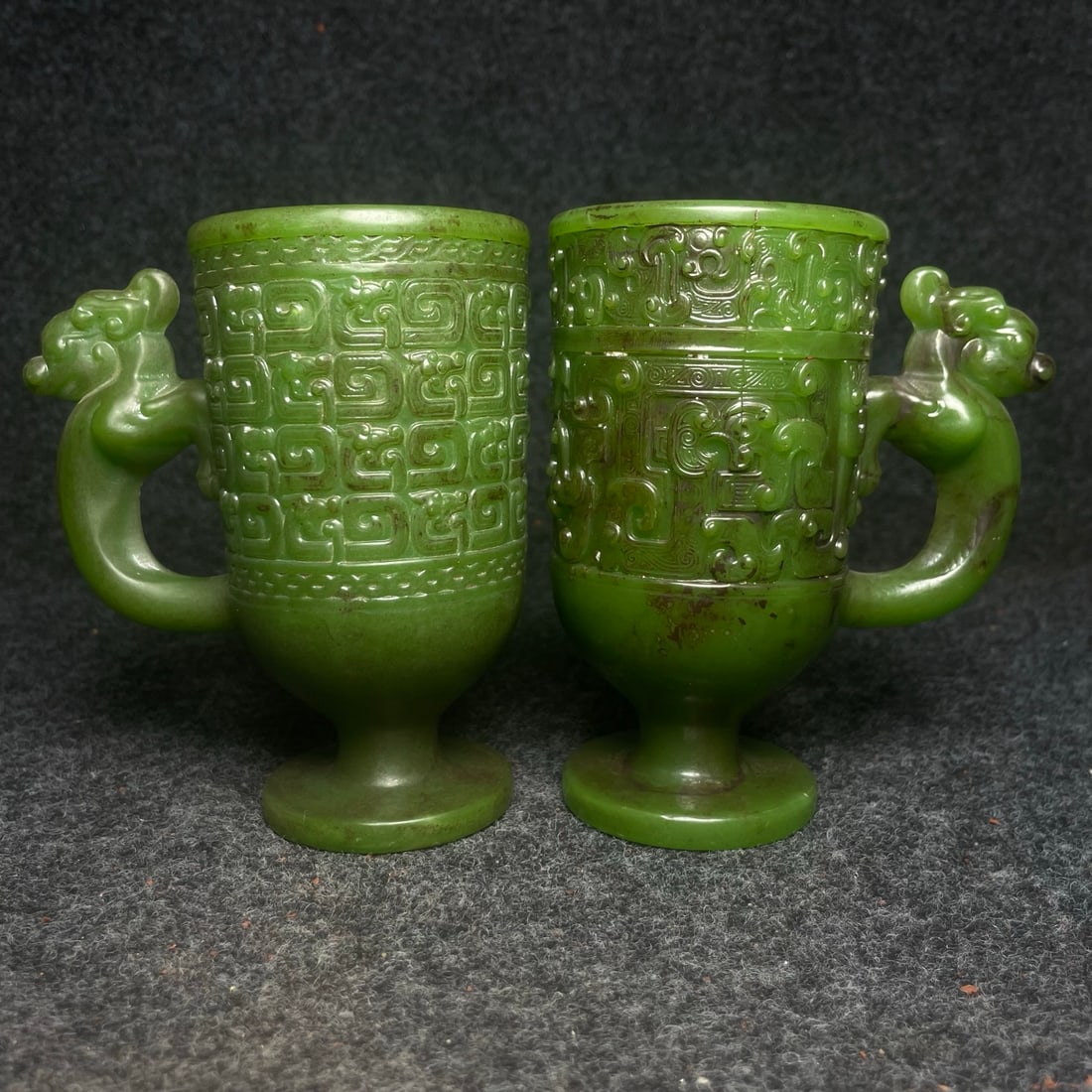 A pair of ancient jade ornaments: A pair of ancient jade ornaments, each measuring 11.5 x 7 x 13 cm (length x width x height). Provenance:Private collection from a professor in University of Glasgow. We warmly invite collectors, colle