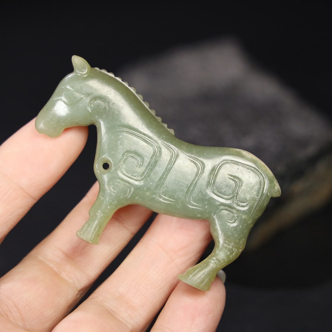 Former Collection of Hetian Jade Horse: This is a formerly owned Hetian jade horse. The jade is fine and oily, with a well-developed patina. Details are shown in the picture. Dimensions: 7.1cm long, 4.6cm wide, 1cm thick, and weight: 39g. P