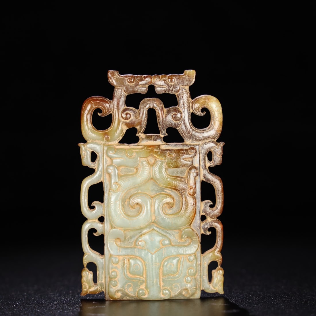 Former Collection of Hetian Jade Dragon Pendant (Warring States and Han Dynasties): This is a collection of Hetian jade dragon pendant from the Warring States period (1900-1940). The jade is fine and lustrous, with a well-developed patina. Details are shown in the picture. Dimensions