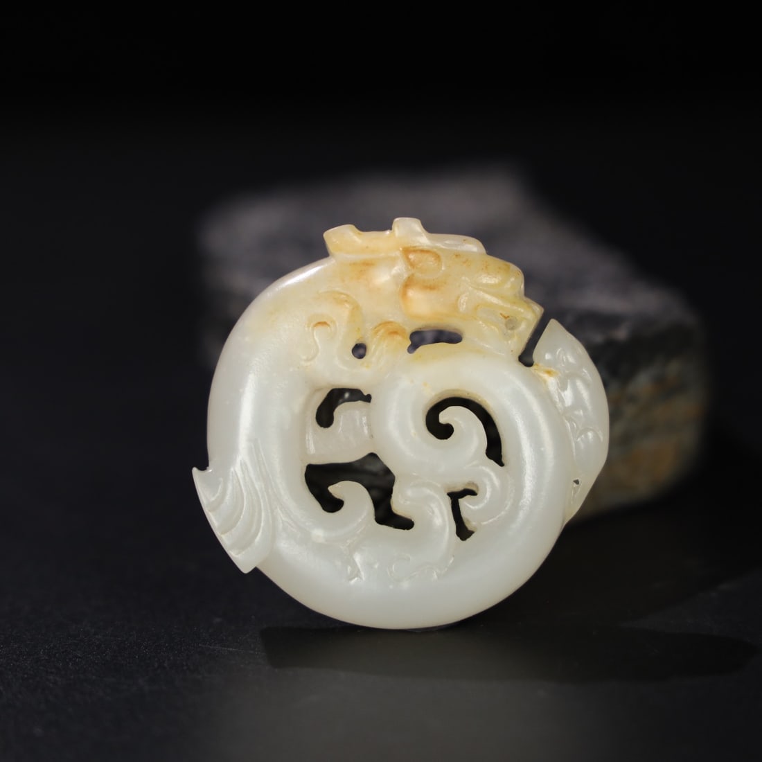 Formerly owned Hetian jade pendant depicting a son becoming a dragon. (1 of 9)