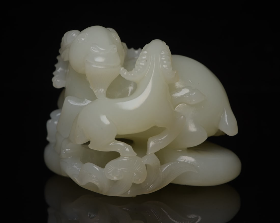 Hetian Jade Auspicious Symbol: The Hetian jade Ruyi scepter measures 7.3 x 5.7 x 5.7 cm and weighs 261 g. Provenance:from the collection of George Stopher, Kent, purchased from P&M Waldo Antiques, London. We warmly invite collector