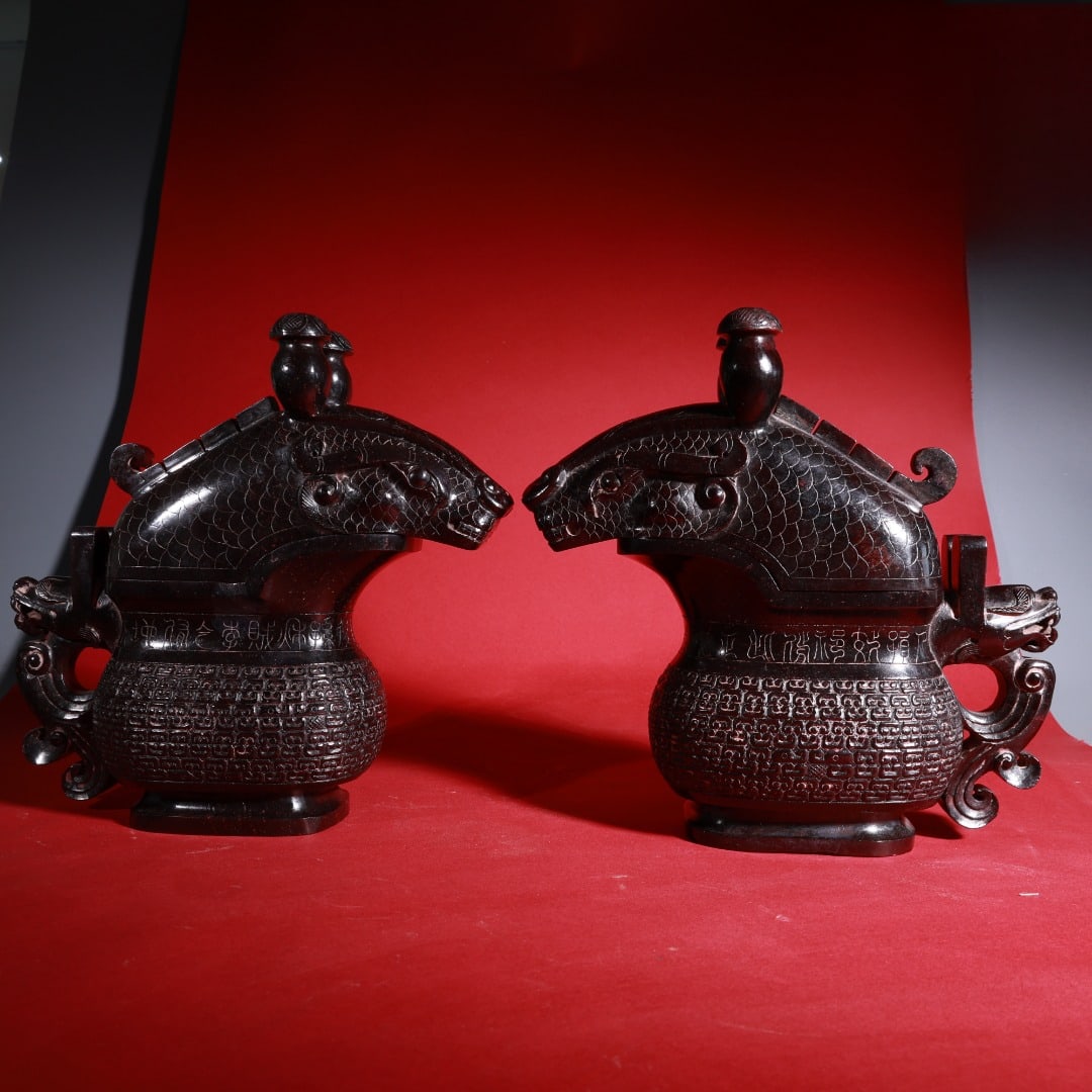 A pair of jade goblets carved with dragon heads in the round, made of Hetian jade with mercury (1 of 9)