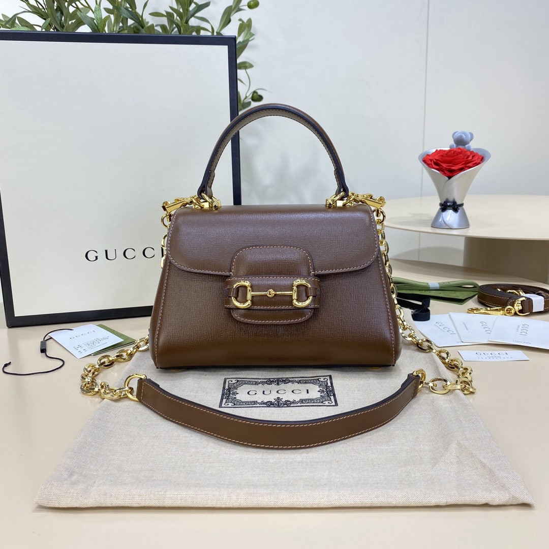GUCCI Horsebit: We offer FREE SHIPPING for both domestic and international clients who bid over $500. The GUCCI Horsebit 1955 small handbag, crafted from brown leather, draws inspiration from the brand's equestrian h
