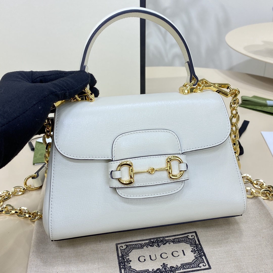 GUCCI Horsebit: We offer FREE SHIPPING for both domestic and international clients who bid over $500. The GUCCI Horsebit 1955 small white tote bag is crafted from white leather. Inspired by the brand's equestrian roo