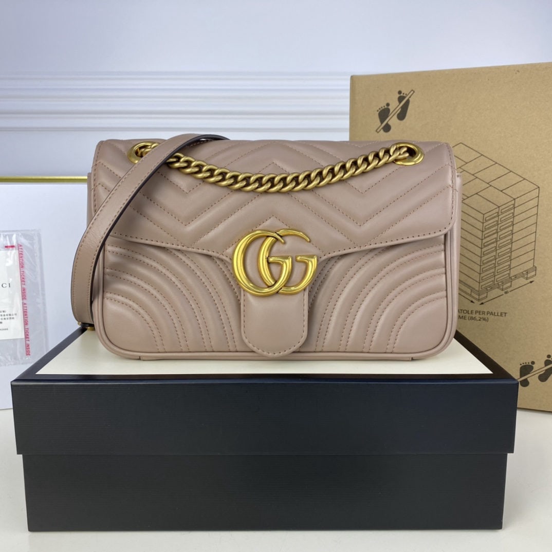 GUCCI MARMONT: We offer FREE SHIPPING for both domestic and international clients who bid over $500. The GUCCI MARMONT medium-sized bag in a milk tea color boasts a structured yet soft silhouette and an oversized fl