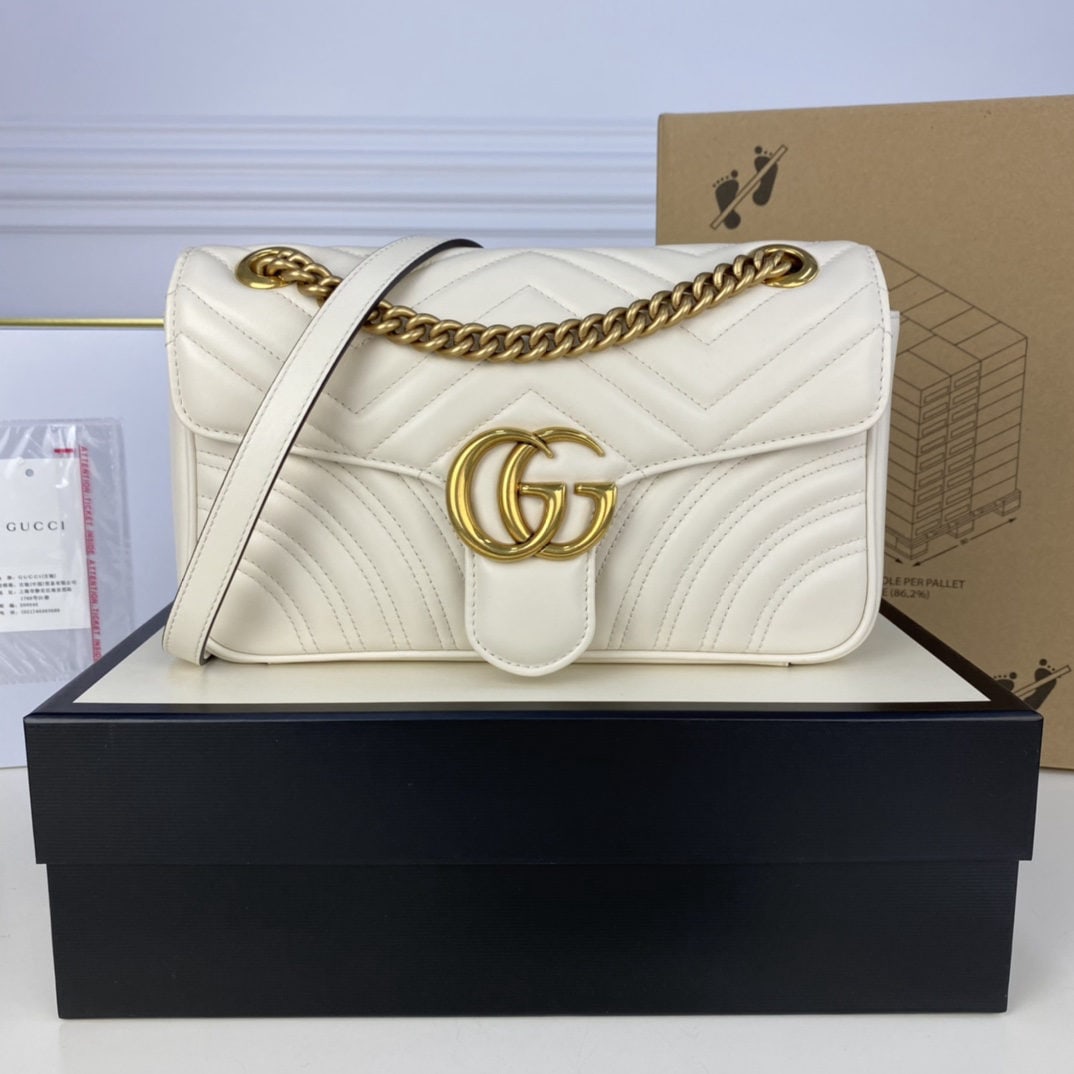 GUCCI MARMONT: We offer FREE SHIPPING for both domestic and international clients who bid over $500. The GUCCI MARMONT Milkshake White Medium boasts a structured yet supple shape and an oversized flap closure. The h