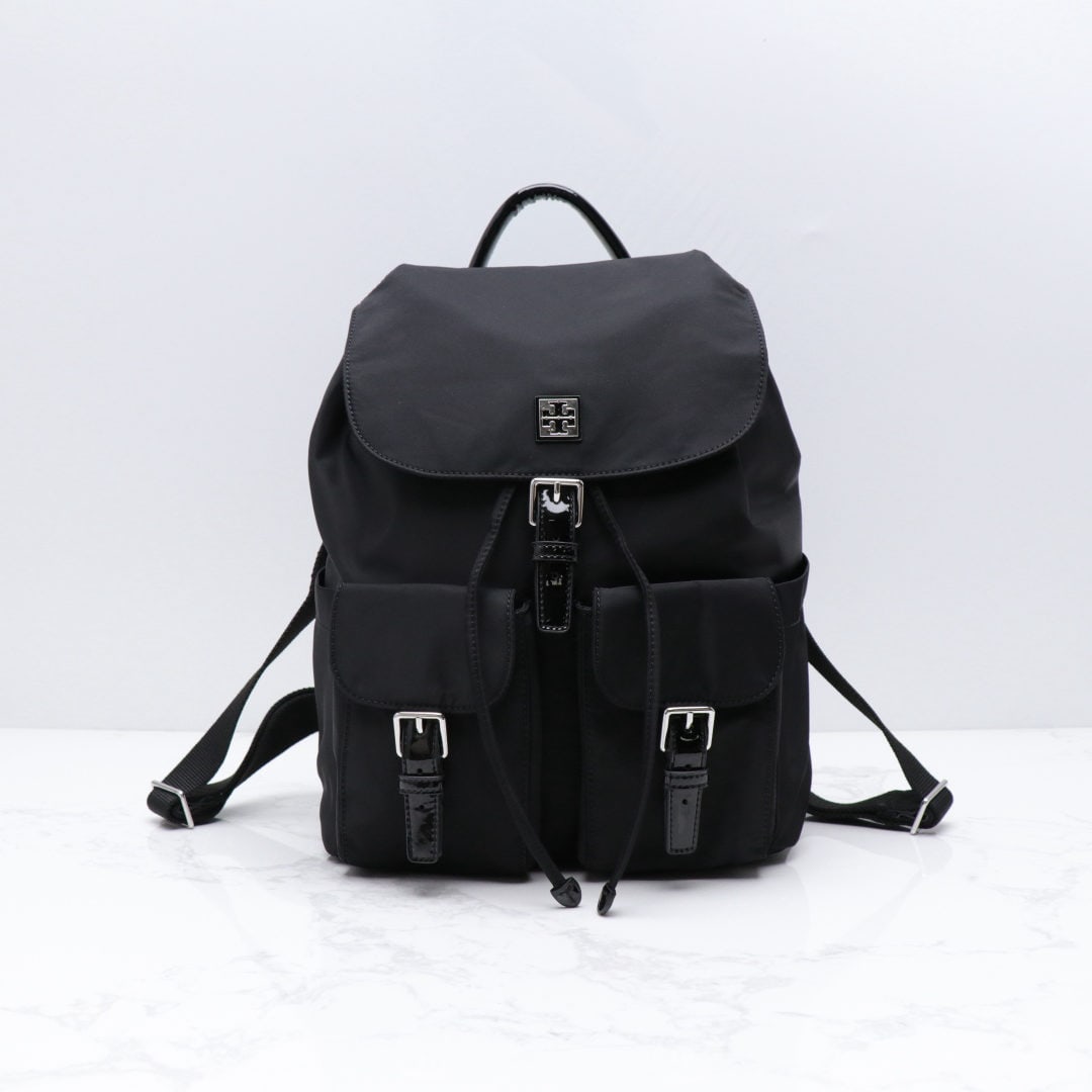 Tory Burch: We offer FREE SHIPPING for both domestic and international clients who bid over $500. Tory Burch nylon backpack with waterproof nylon fabric and drawstring closure; flap with magnetic snap closure und