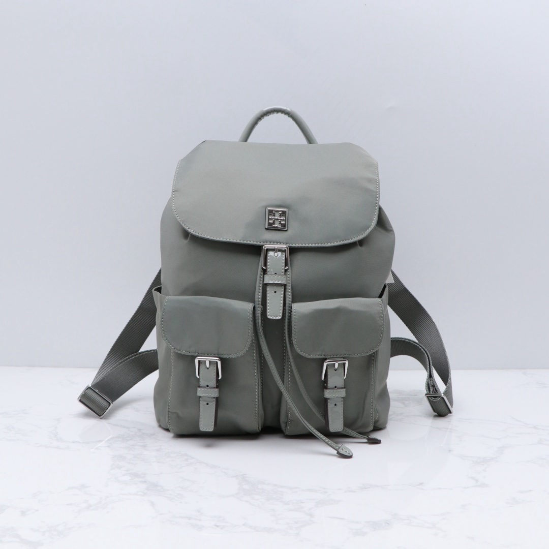 Tory Burch: We offer FREE SHIPPING for both domestic and international clients who bid over $500. Tory Burch nylon backpack with waterproof nylon fabric and drawstring closure; flap with magnetic snap closure und