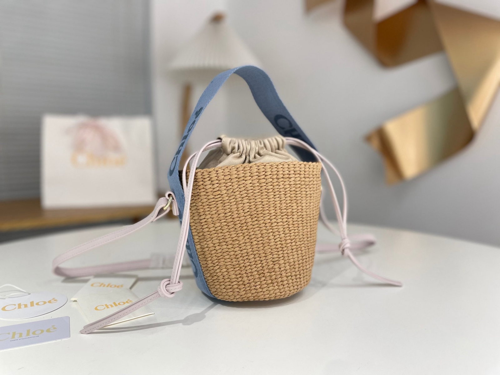 Chloe Woody: We offer FREE SHIPPING for both domestic and international clients who bid over $500. Chloe Woody straw beach bag/bucket bag in blue and pink color blocking. Chloe Woody's most beautiful straw bag fea