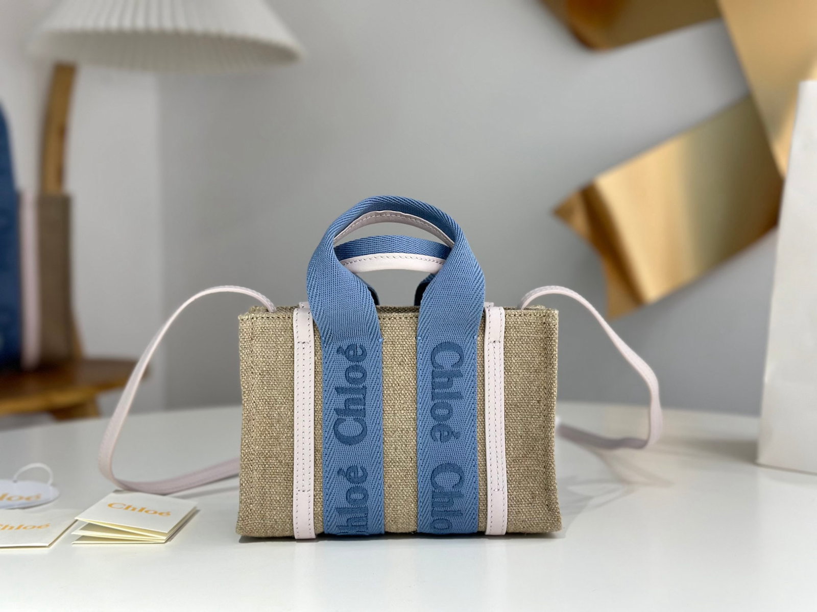 Chloe woody Tote: We offer FREE SHIPPING for both domestic and international clients who bid over $500. The mini size is absolutely gorgeous! The Chloe Woody Tote in creamy pink with blue webbing is stunning. The bag i