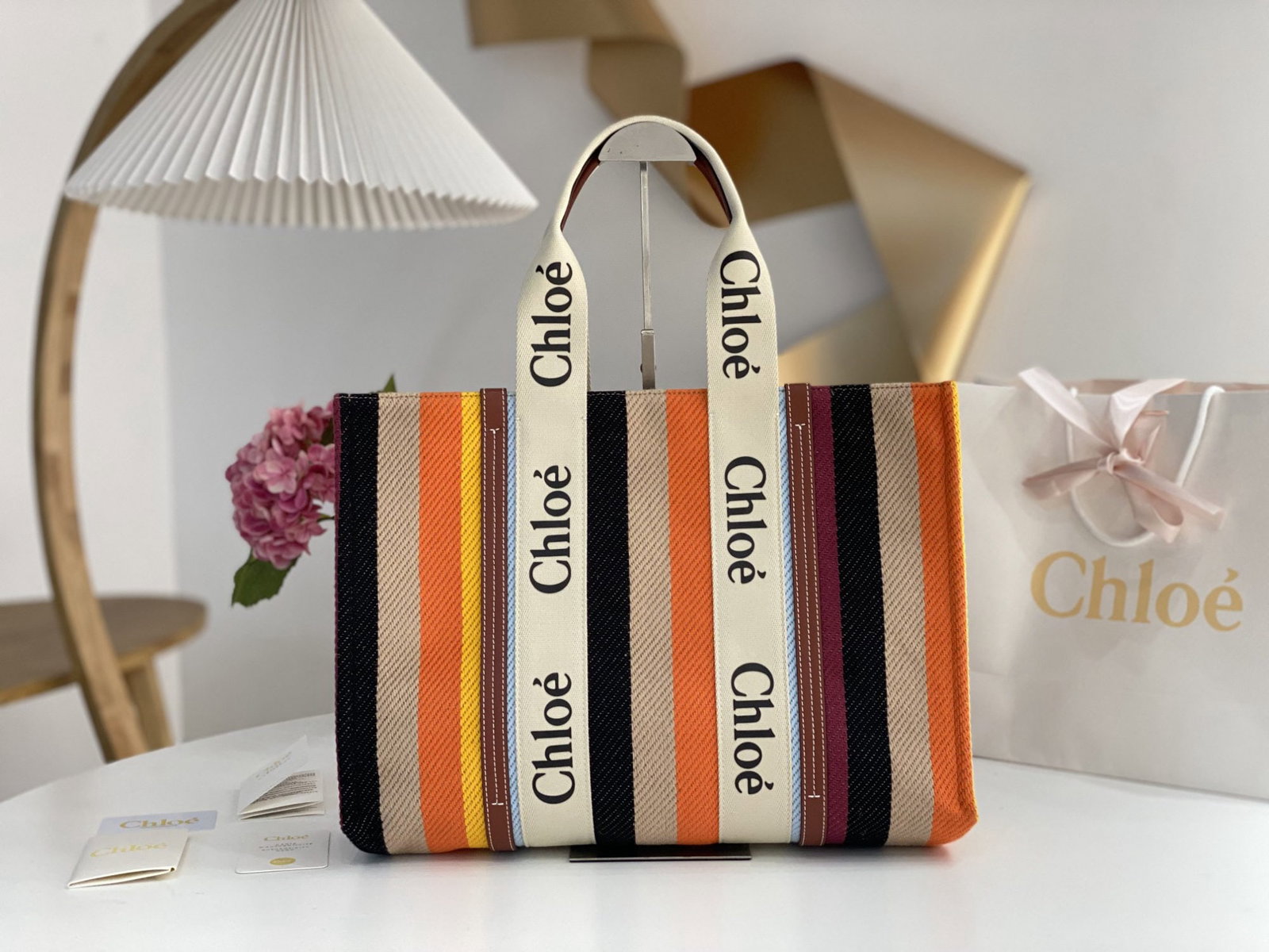 Chloe Woody: We offer FREE SHIPPING for both domestic and international clients who bid over $500. This Chloe Rainbow Woody Tote bag features a beautiful rainbow color scheme and is crafted from linen striped cott