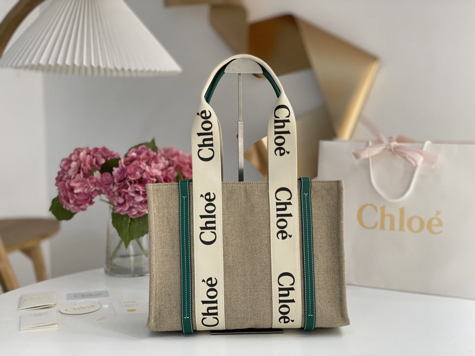 Chloe Woody: We offer FREE SHIPPING for both domestic and international clients who bid over $500. The Chloe Woody in emerald green linen has been redesigned using environmentally friendly and more structured line