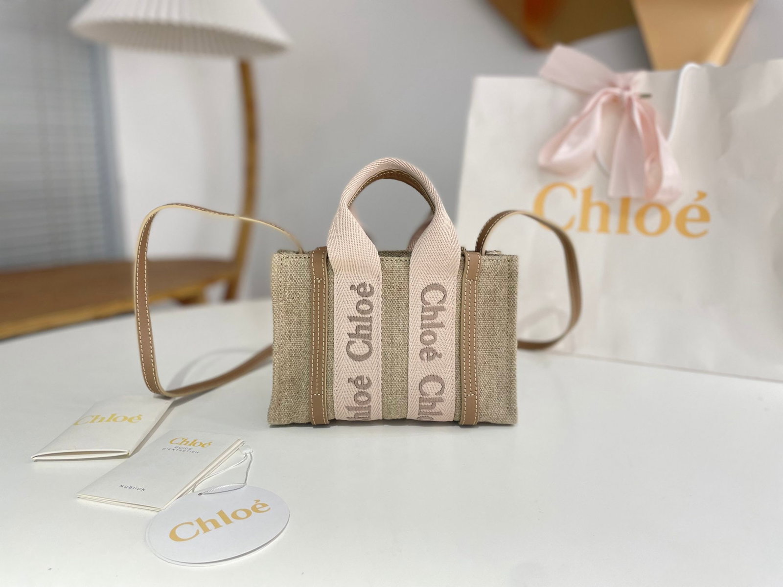 Chloe Woody: We offer FREE SHIPPING for both domestic and international clients who bid over $500. The mini "Blush Pink" Chloe Woody Family tote bag is here! The soft, misty pink ribbon and embroidered lettering c