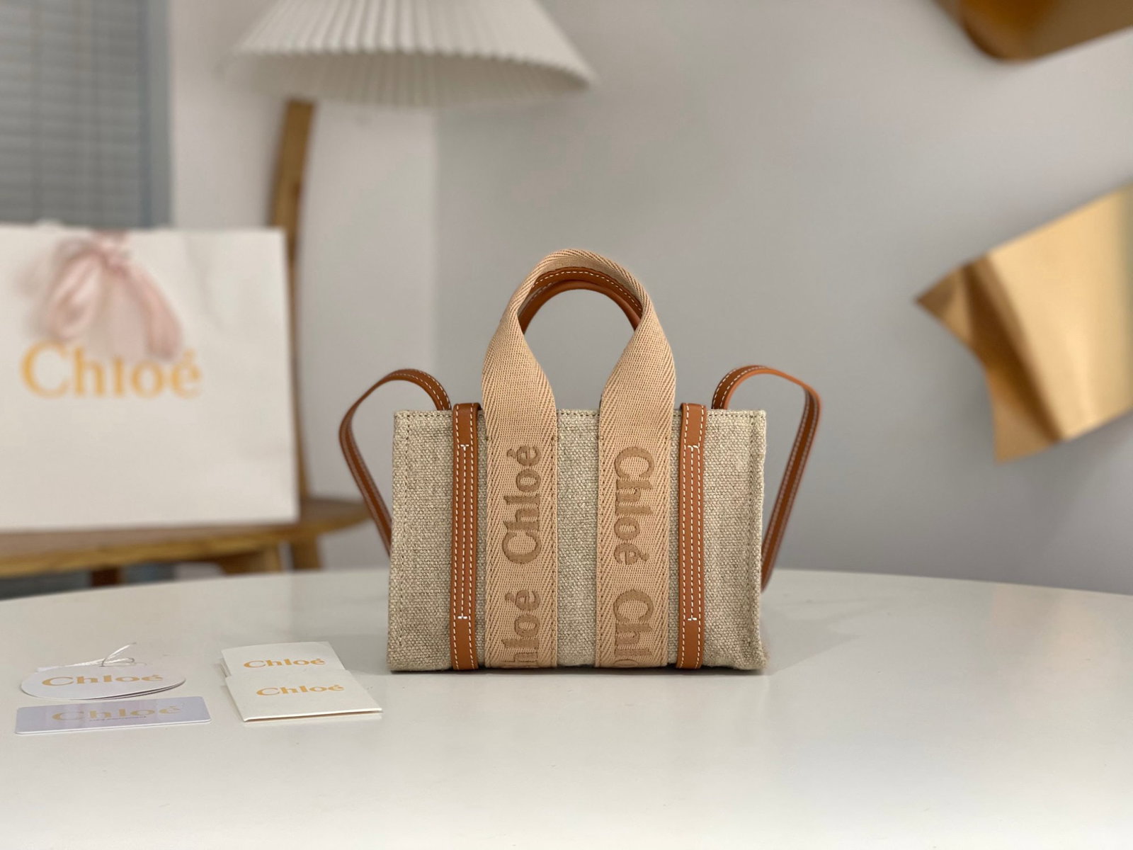 Chloe Woody: We offer FREE SHIPPING for both domestic and international clients who bid over $500. The mini Chloe Spring/Summer 2017 Woody Tote is a sweet caramel milk tea color. The ribbon is a pure cotton orange