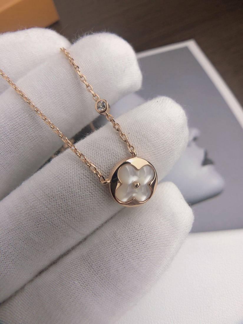 LV classic monogram white necklace: We offer FREE SHIPPING for both domestic and international clients who bid over $500. The classic LV monogram white mother-of-pearl necklace is made of crystal-clear mother-of-pearl, shimmering with i